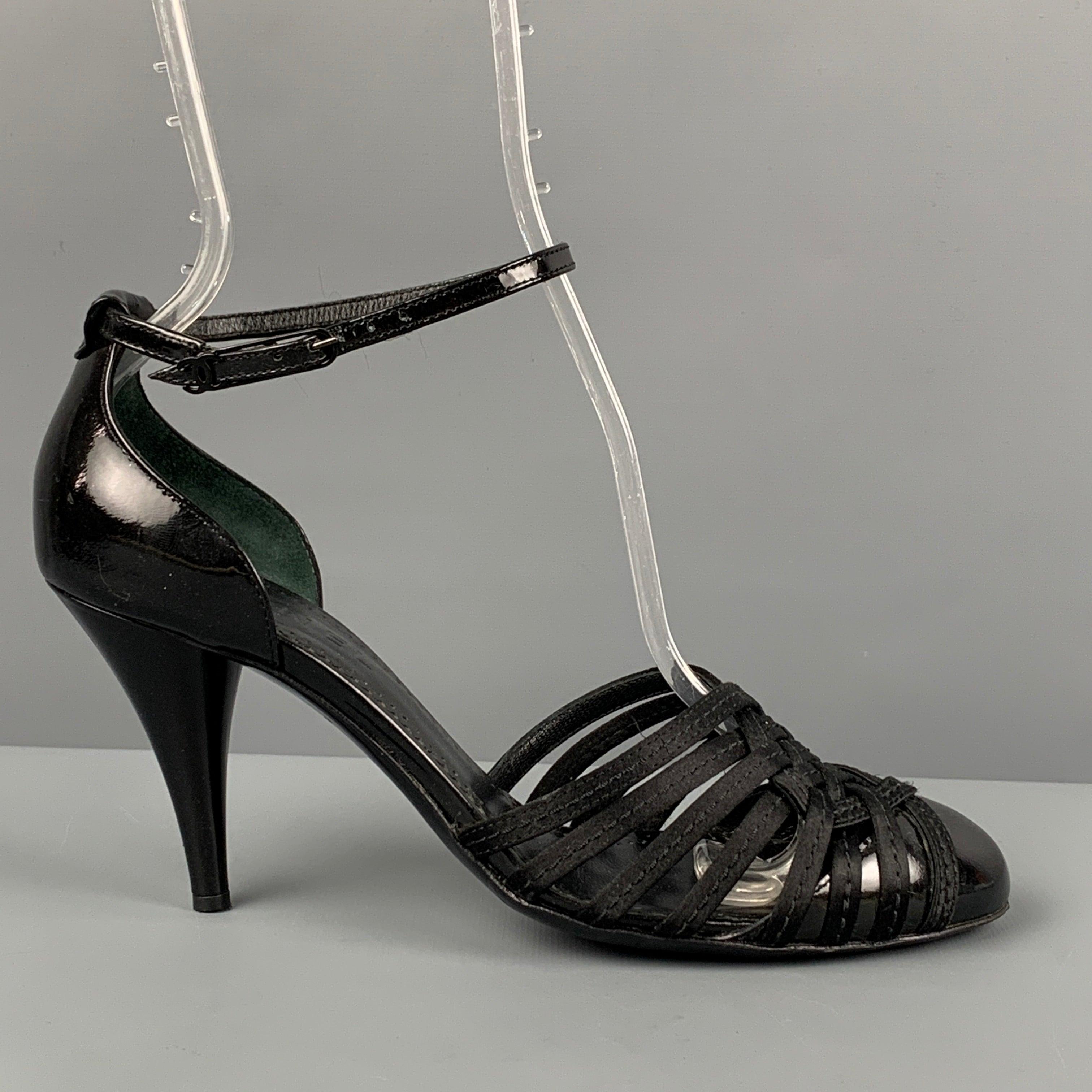 CHANEL pumps in a black silk featuring a open toe, ankle strap, patent leather trim, and a chunky heel. Made in Italy. Excellent Pre-Owned Condition. 

Marked:   37.5 

Measurements: 
  Heel: 3.25 inches  
  
  
 
Sui Generis Reference: