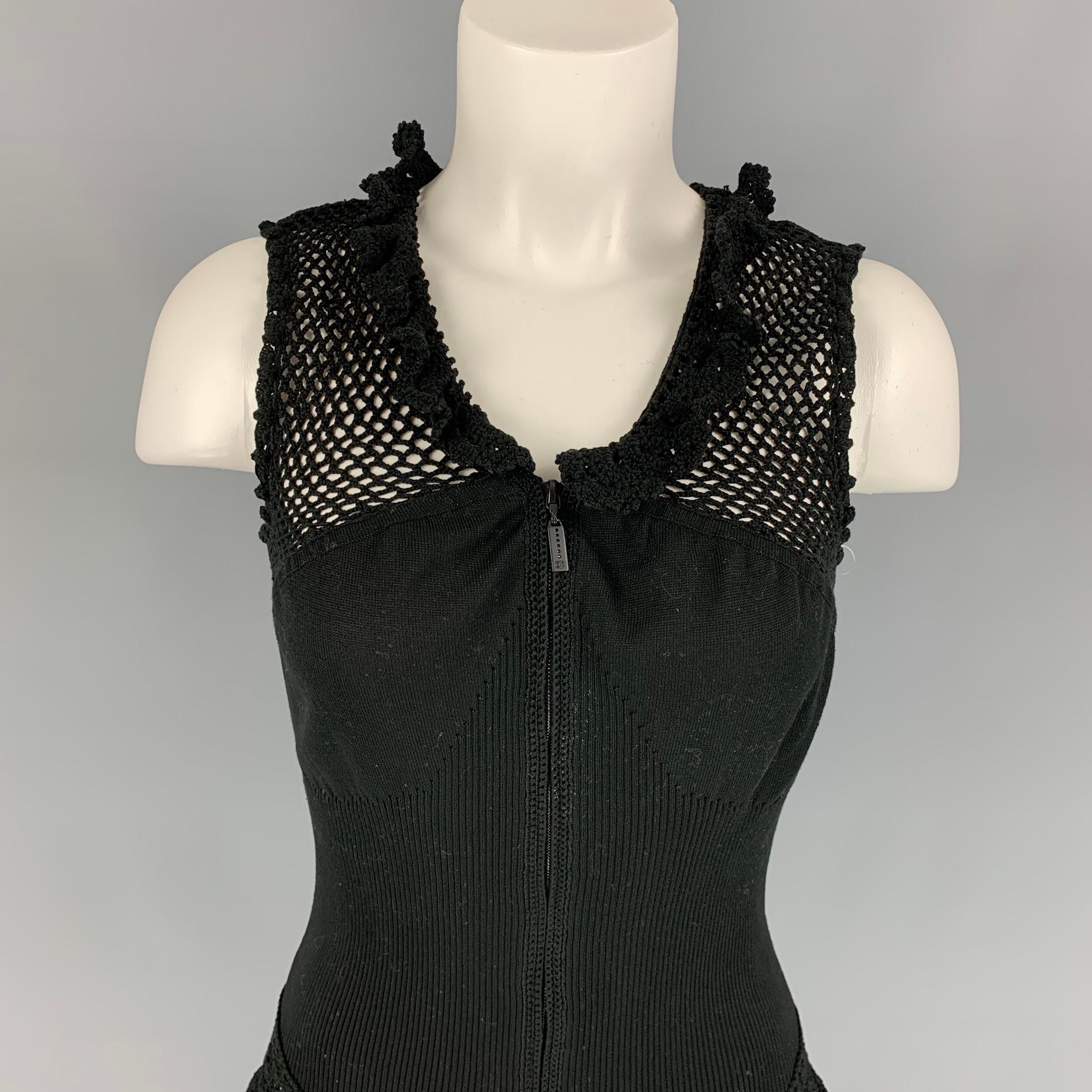 CHANEL blouse comes in a black crochet cotton featuring a ruffles collar, sleeveless, and a front zip up closure. Made in Italy. 

Very Good Pre-Owned Condition.
Marked: 40

Measurements:

Shoulder: 12 in.
Bust: 26 in.
Length: 21 in. 