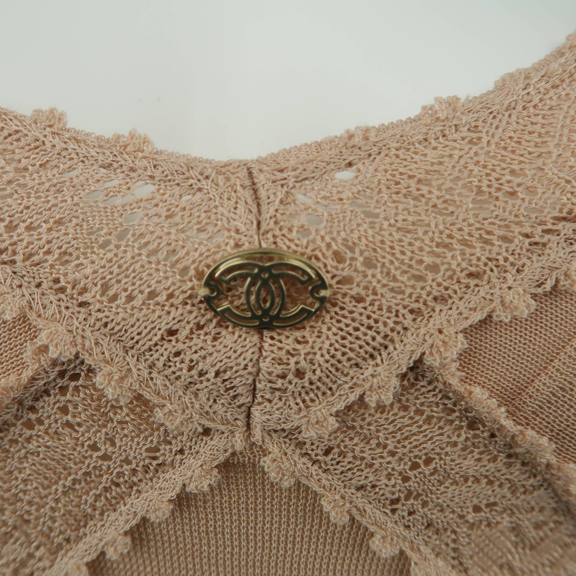 CHANEL camisole top comes in muted rose pink rayon knit with skinny, textured straps, bandage like constructions, knit lace trim, pleated hem, and gold tone logo. Made in France.
 
Good Pre-Owned Condition.
Marked: FR 40  (07C)
 
Measurements:
