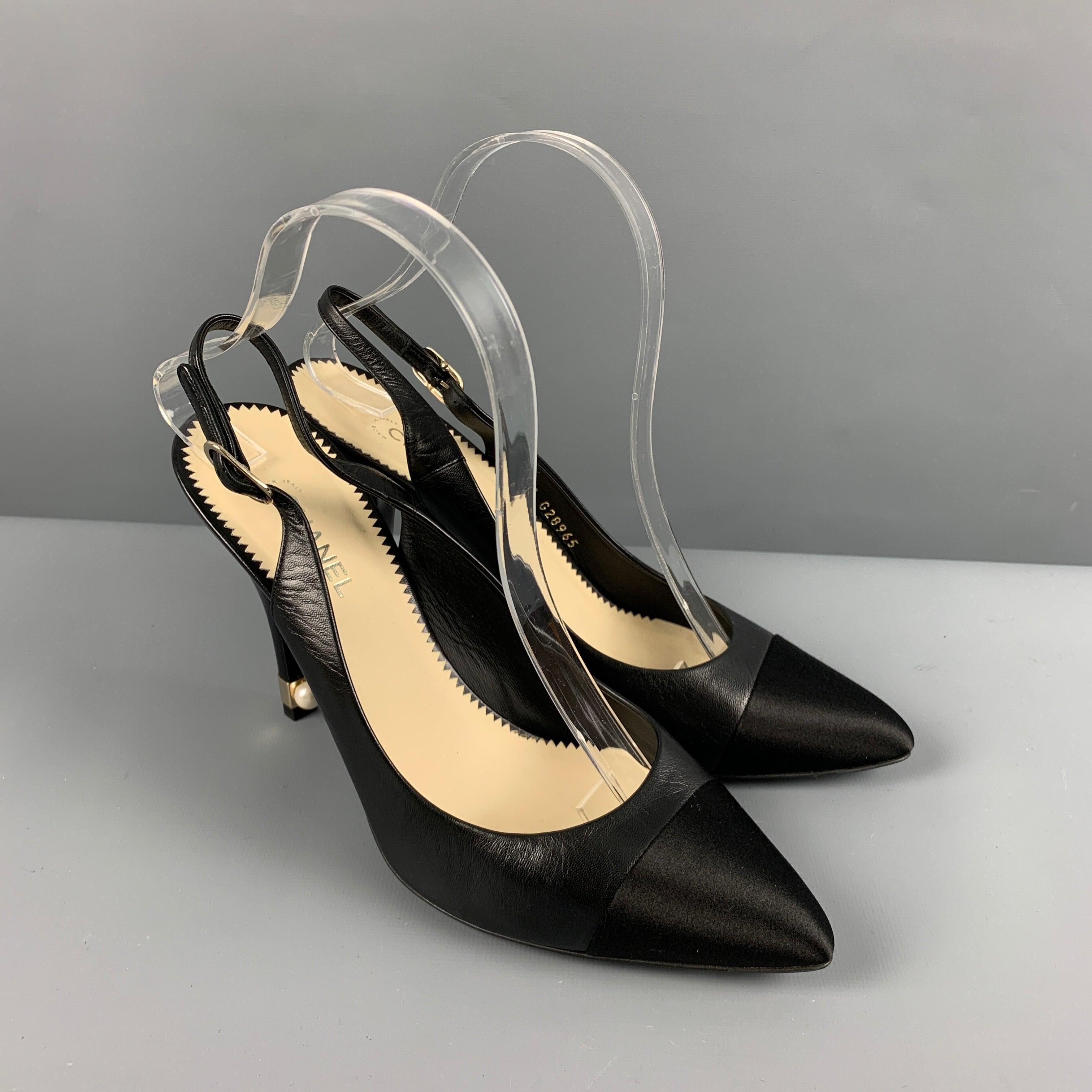 CHANEL pumps
in a black leather featuring a slingback style, pearl heel detail, and luxurious gold tone hardware. Comes with dust bags. Made in Italy. Very Good Pre-Owned Condition. Minor signs of wear. 

Marked:   G G28965 

Measurements: 
  Heel: