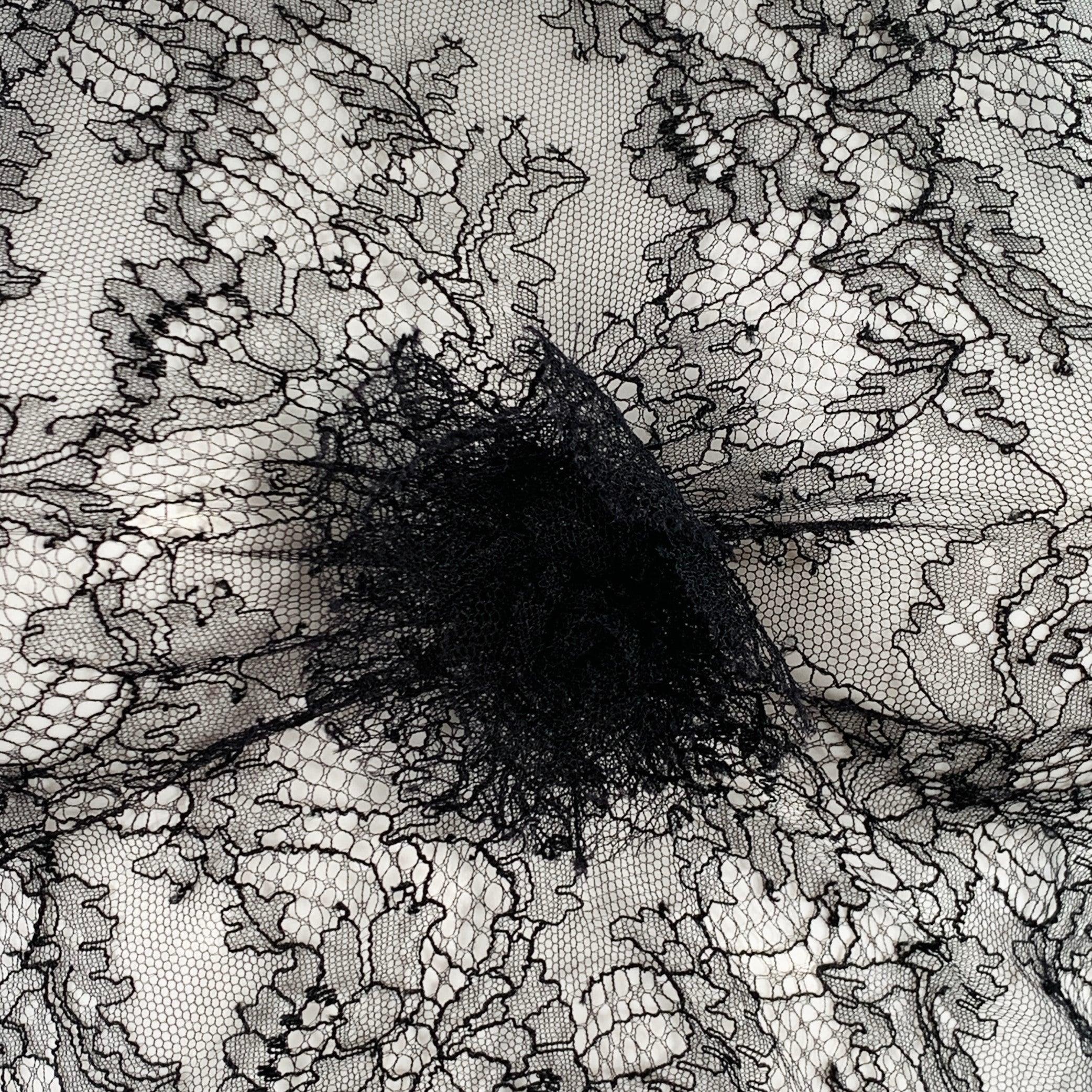 CHANEL dress top
in a sheer black lace featuring a sleeveless style, floral design with signature camellia detail, and crew neck. Very Good Pre-Owned Condition. Tags removed, minor snag. 

Marked:   size not marked 

Measurements: 
 
Shoulder: 12.75