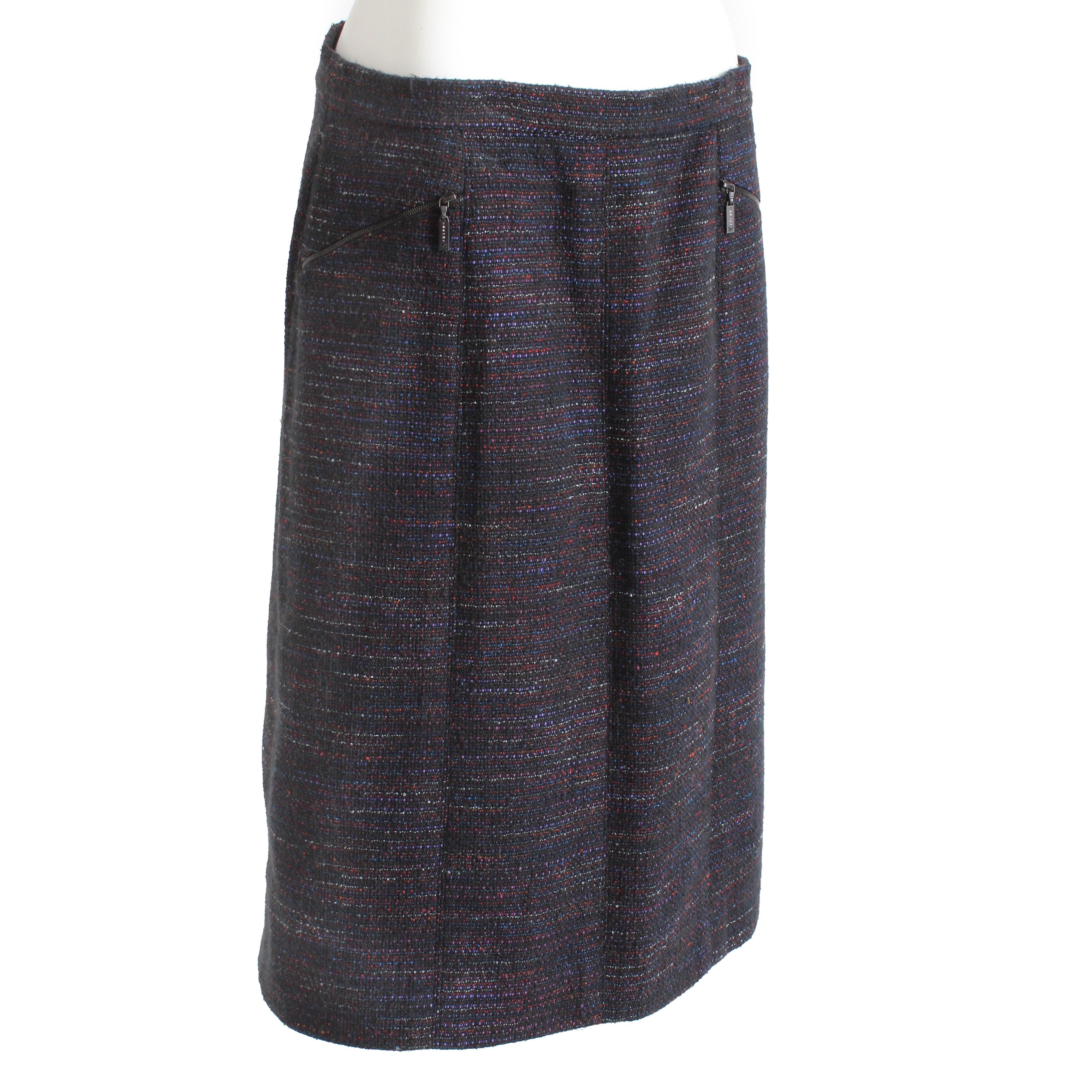 Authentic, preowned and vintage skirt, made by CHANEL for their 02A collection. Made from a gorgeous supple tweed with multicolor thread woven against a black background, it features two embellished CC zipper pull pockets in front and a CC button