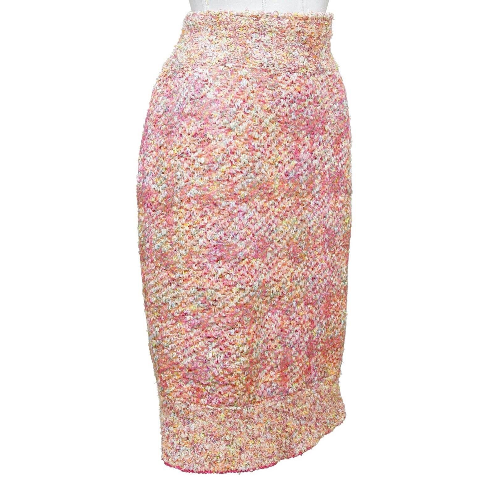 GUARANTEED AUTHENTIC CHANEL PINK FANTASY HIGH WAISTED SKIRT

Design:
- Fantasy knit tweed skirt in shades of pink with iridescent threading.
- High waisted.
- Side concealed zipper.
- Chanel plaque at left hip.
- Lined.

Fabric: 64% Polyamide, 35%