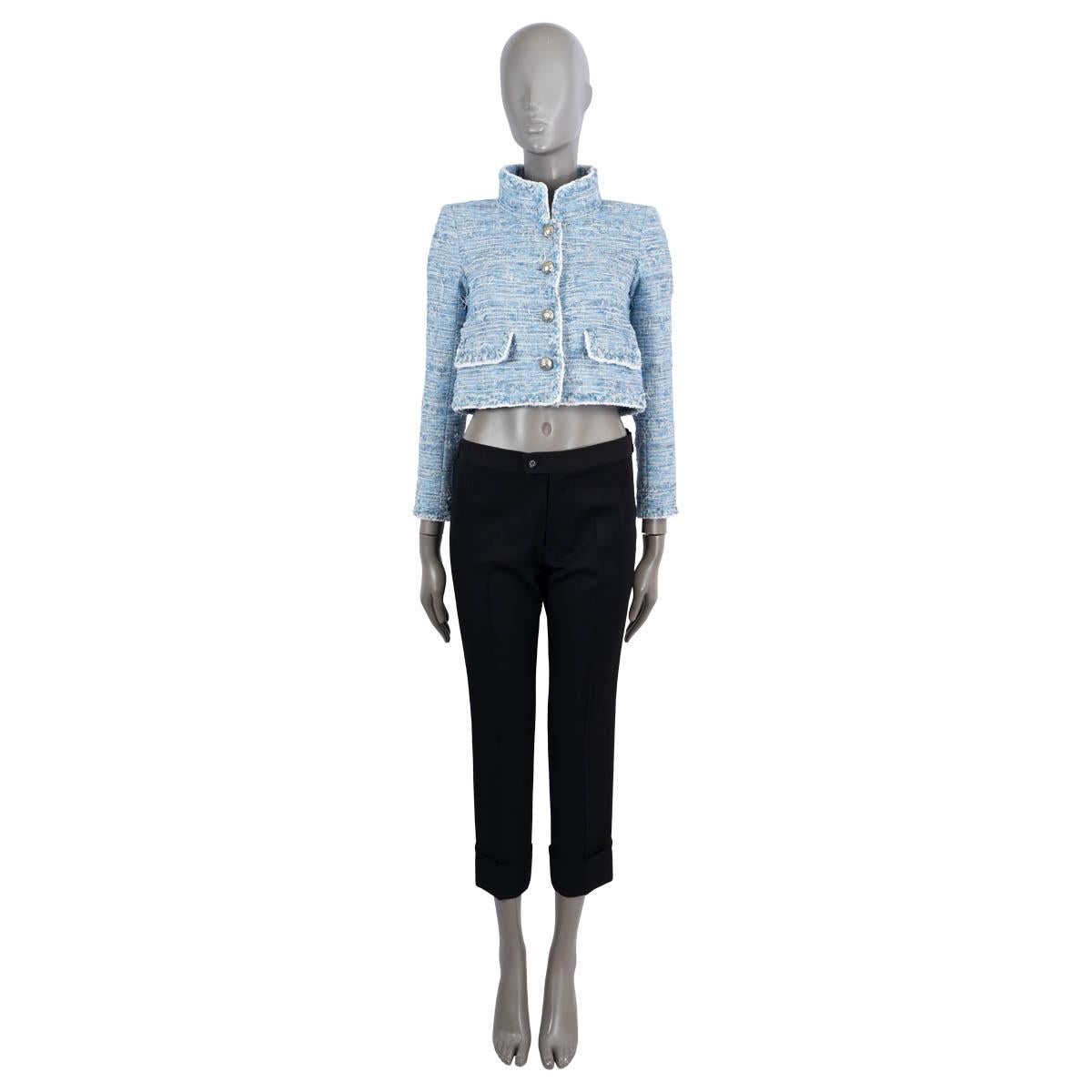 100% authentic Chanel cropped tweed jacket in sky blue and white polyester (78%), cotton (20%) and nylon (4%). Features a high stand-up collar and two flap pockets. Closes with gold-tone buttons on the front and is lined in silk (100%). Has been