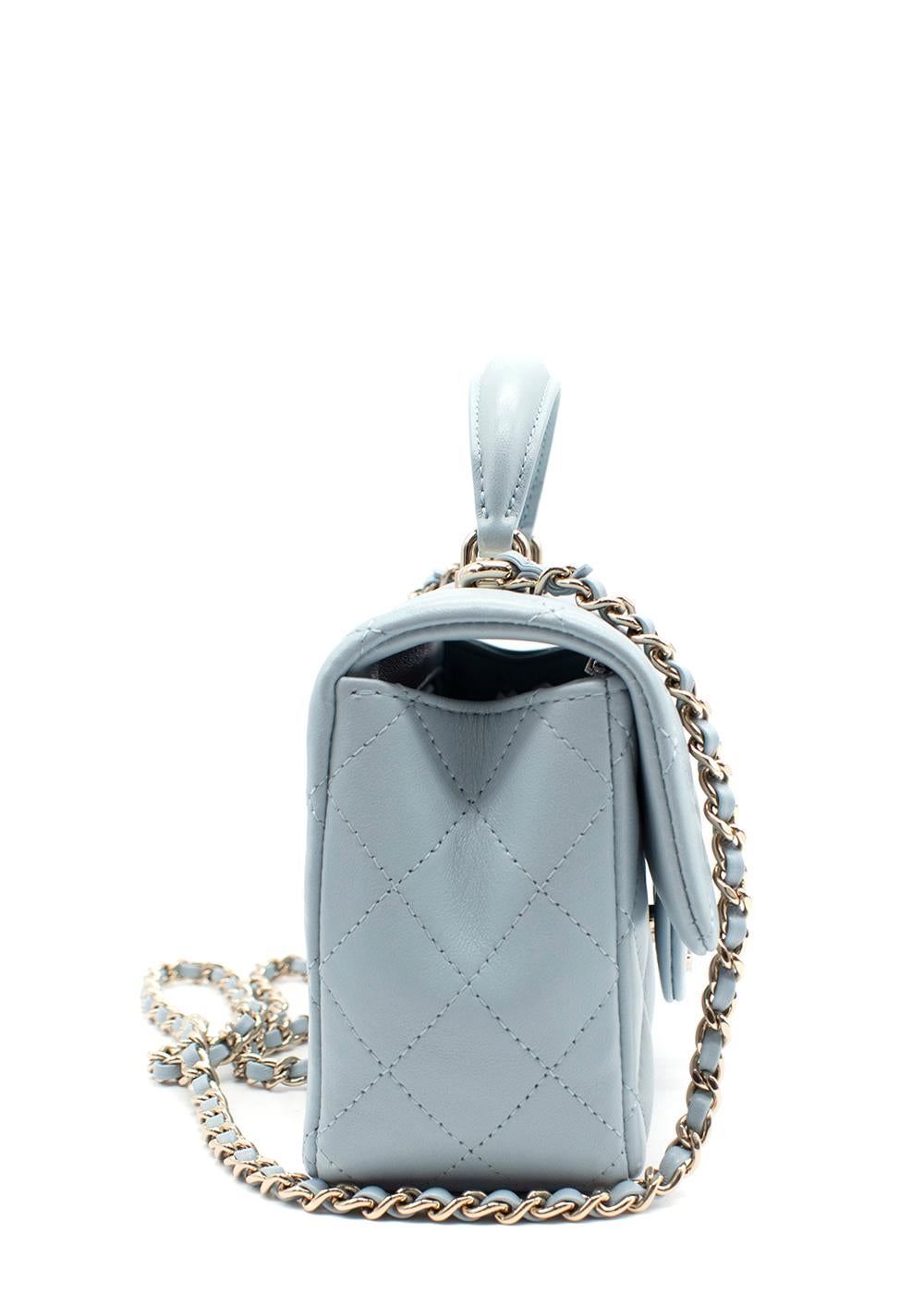 Chanel Sky Blue Leather Quilted Mini Top Handle Flap Bag

- Sky blue lambskin outer, with signature diamond quilting
- Top handle flap, with CC turnlock closure
- Leather and chain strap
- Opens to leather-lined interior with zipped pocket and logo