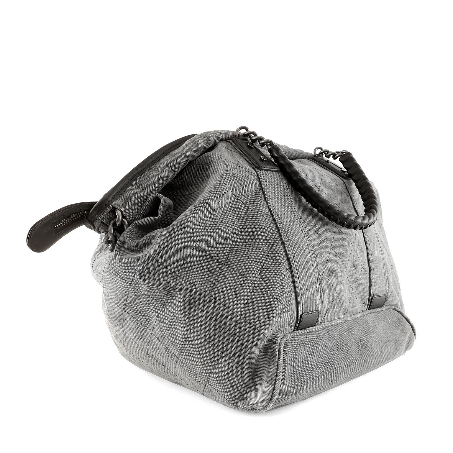 Chanel Slate Grey Canvas XL Tote-Excellent Plus Condition
Perfect for travel and quick getaways, the unisex style is chic and roomy.
Slate grey canvas tote has tonal topstitching in signature Chanel diamond pattern.  Two way zippered top accesses