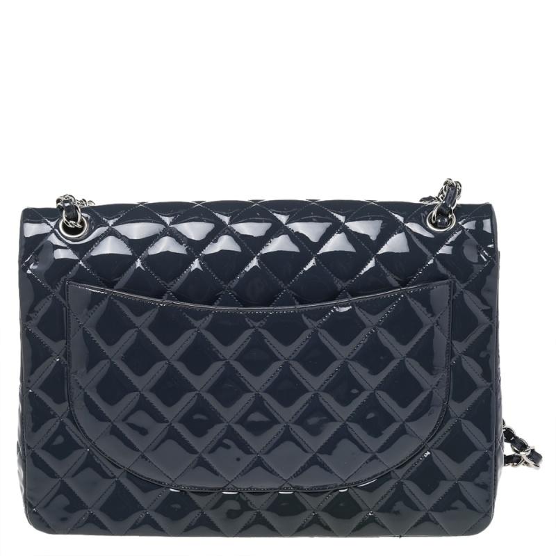 Chanel's Flap bags are the most iconic handbags. The classic double flap bag is crafted from patent leather and features the iconic quilted pattern. It has a chain and leather woven strap along with a CC twist lock closure in silver-tone. The flap