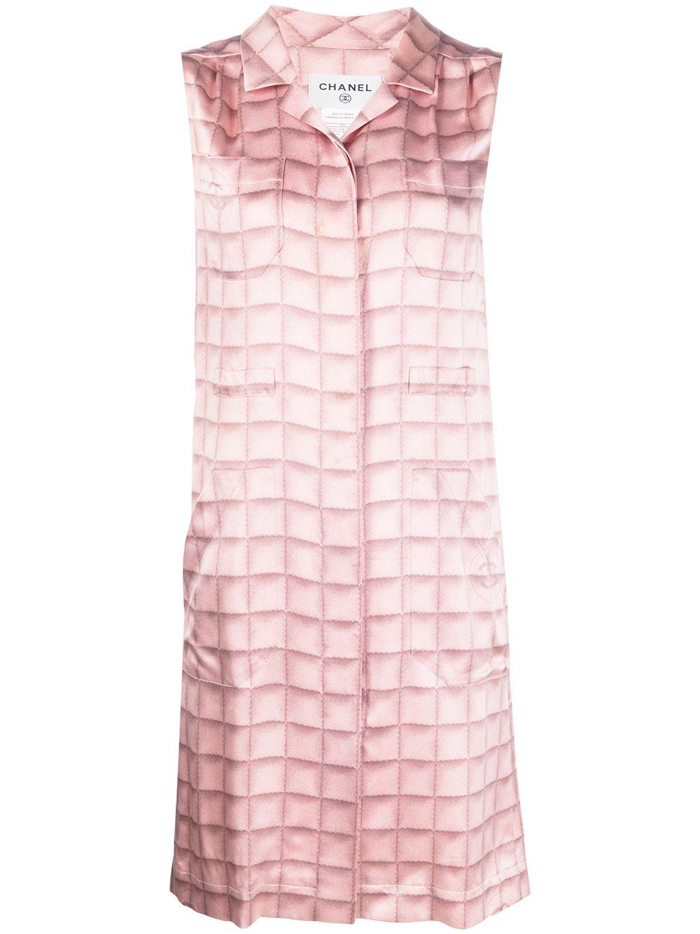 Expertly crafted in France from pure silk, this pre-owned, contemporary-style shirt dress by Chanel showcases a whimsical tie-dye effect check print pattern, a concealed front button fastening, notched lapels and long sleeves with button cuffs.