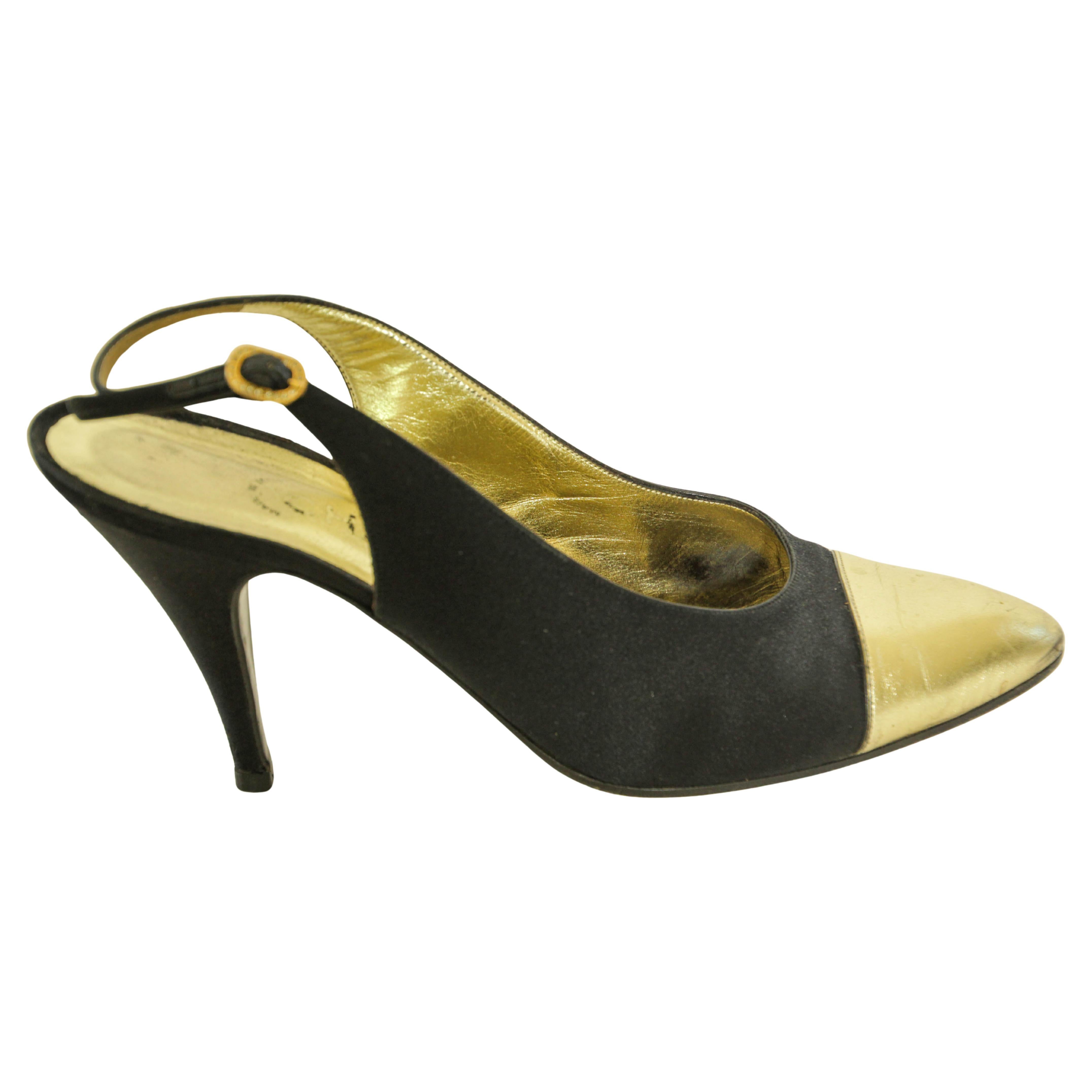 CHANEL Black SATIN Slingback Pumps Heels Shoes.
Vintage Chanel slingback pumps made of black satin with gold calf leather on the tip and inside, and a black leather sole. 
The fine strap on the clasp is made of brass metal and decorated with