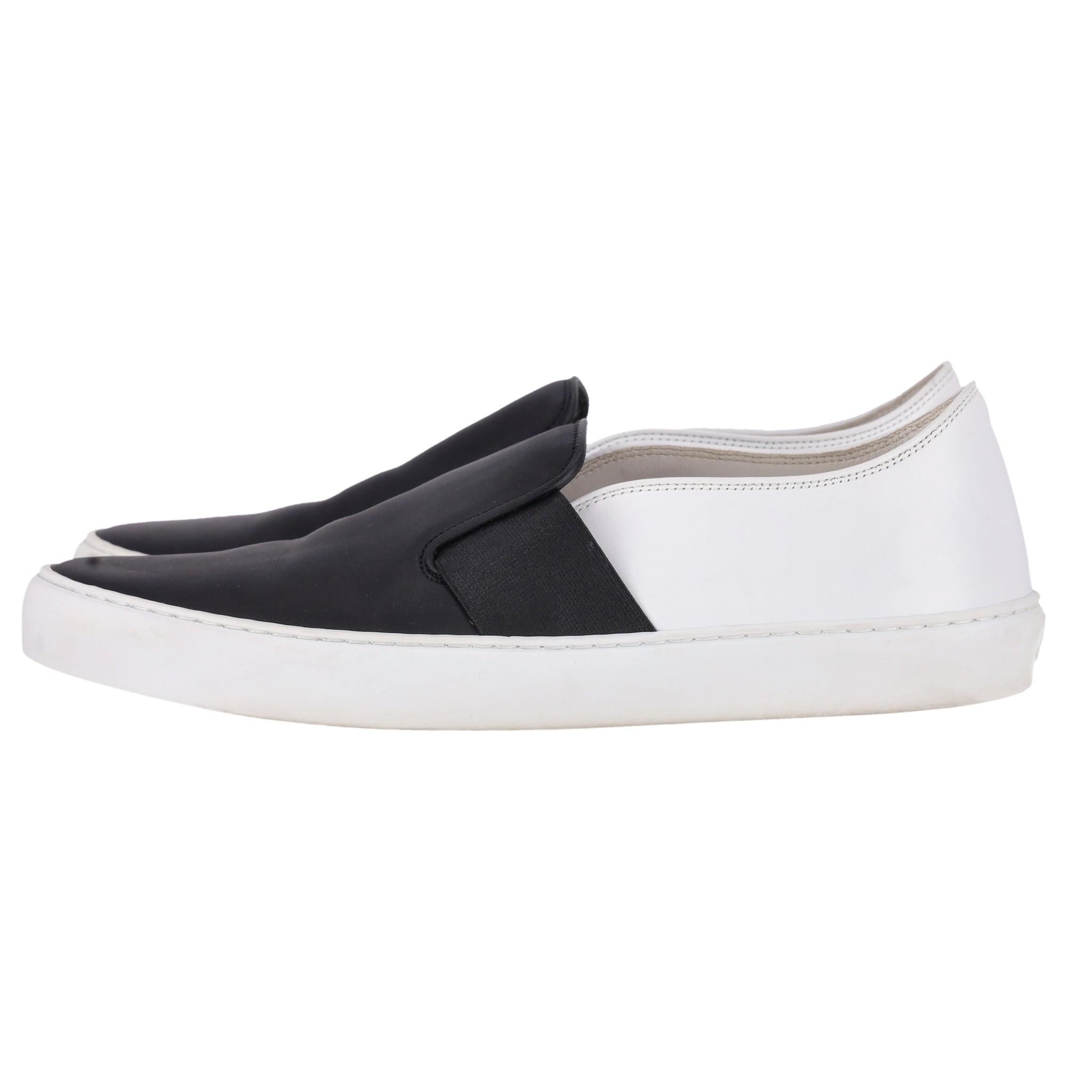 Chanel Slip on Leather Sneakers

In iconic colours, black & white leather with rubber soles.

'CC' logo to the rear of each shoe.

Size - 40.5

Condition - Good ( Some small marks to leather and rubber areas)

Composition - Leather

Comes With -