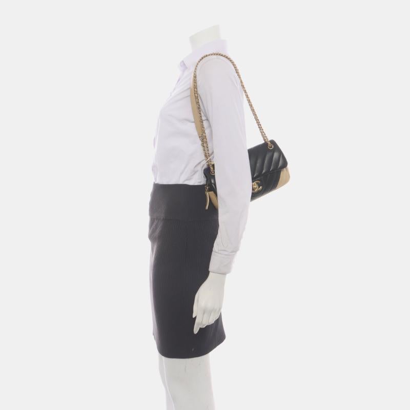 Chanel Small Bicolor Chevron Lambskin Single Flap Bag Black and Gold, 2014-15
 These are professional photos of the actual bag.
 CONDITION: EXCELLENT
 This previously owned and used item is in excellent condition with light signs of use around