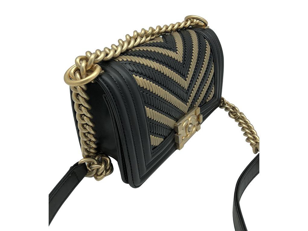 Gorgeous Chanel 2019 Limited Edition Egyptian Small Boy bag for sale. Made from Black and Gold leather in a chevron pattern – just exquisite. This bag is in as new condition.

BRAND	
Chanel

FEATURES	
CC Clasp. closure, One interior compartment, One
