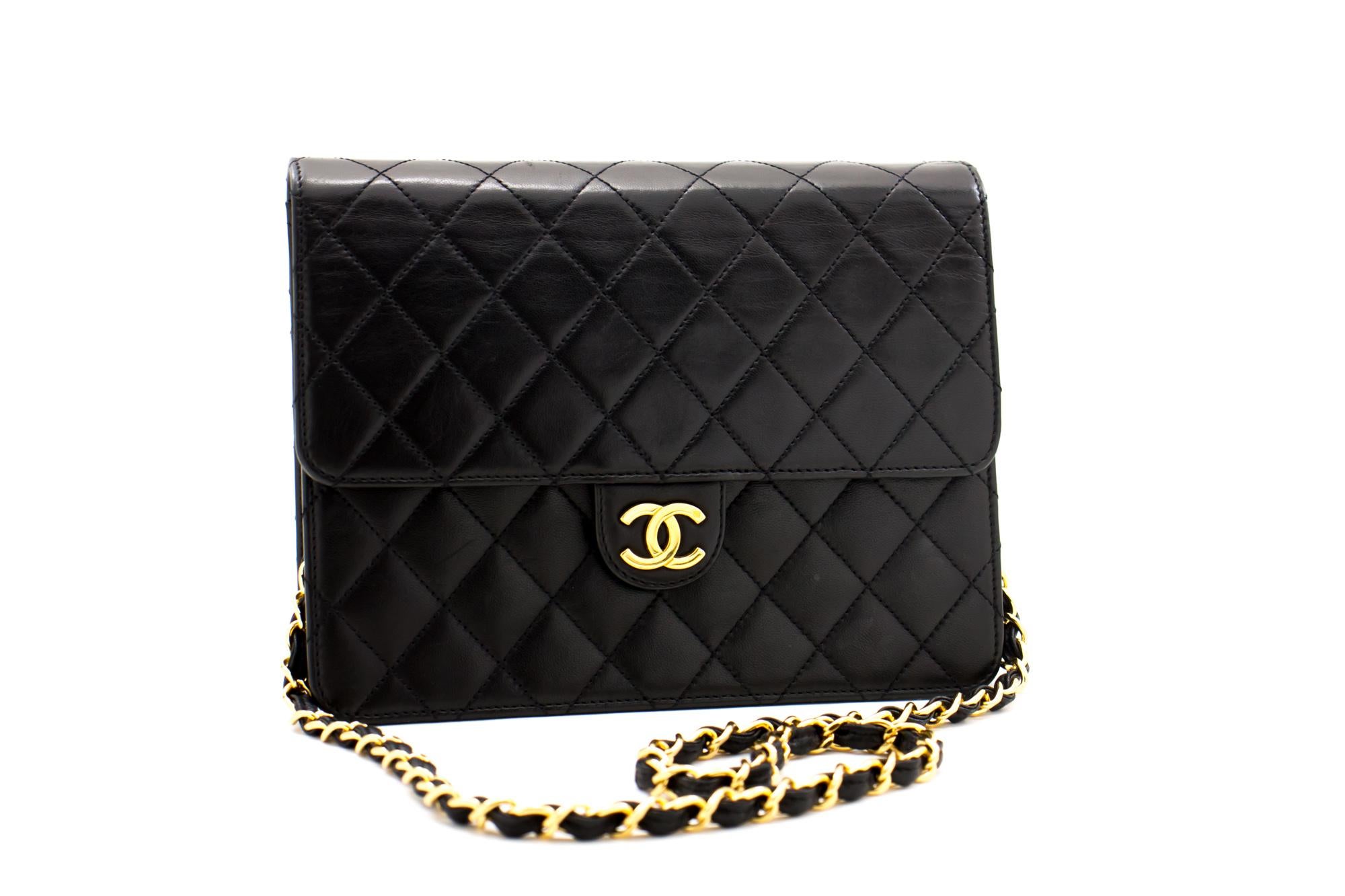 An authentic CHANEL Small Chain Shoulder Bag Clutch Black Quilted Flap made of black Lambskin. The color is Black. The outside material is Leather. The pattern is Solid. This item is Vintage / Classic. The year of manufacture would be