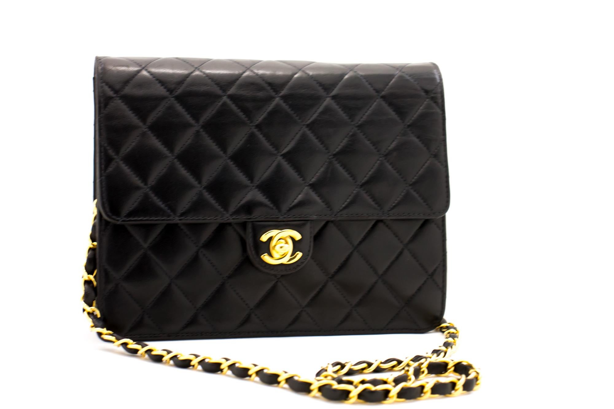 An authentic CHANEL Small Chain Shoulder Bag Clutch Black Quilted Flap made of black Lambskin. The color is Black. The outside material is Leather. The pattern is Solid. This item is Contemporary. The year of manufacture would be 2 0 0 2