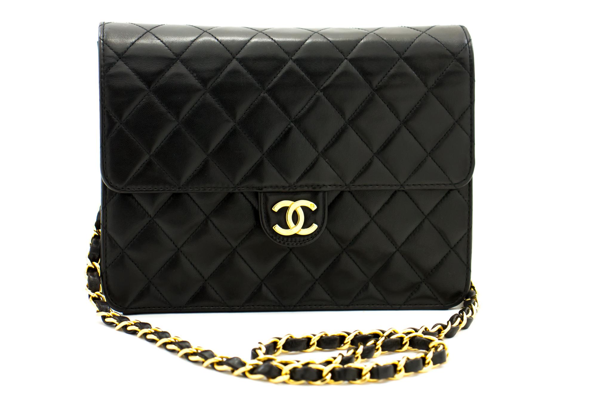An authentic CHANEL Small Chain Shoulder Bag Clutch Black Quilted Flap made of black Lambskin. The color is Black. The outside material is Leather. The pattern is Solid. This item is Vintage / Classic. The year of manufacture would be
