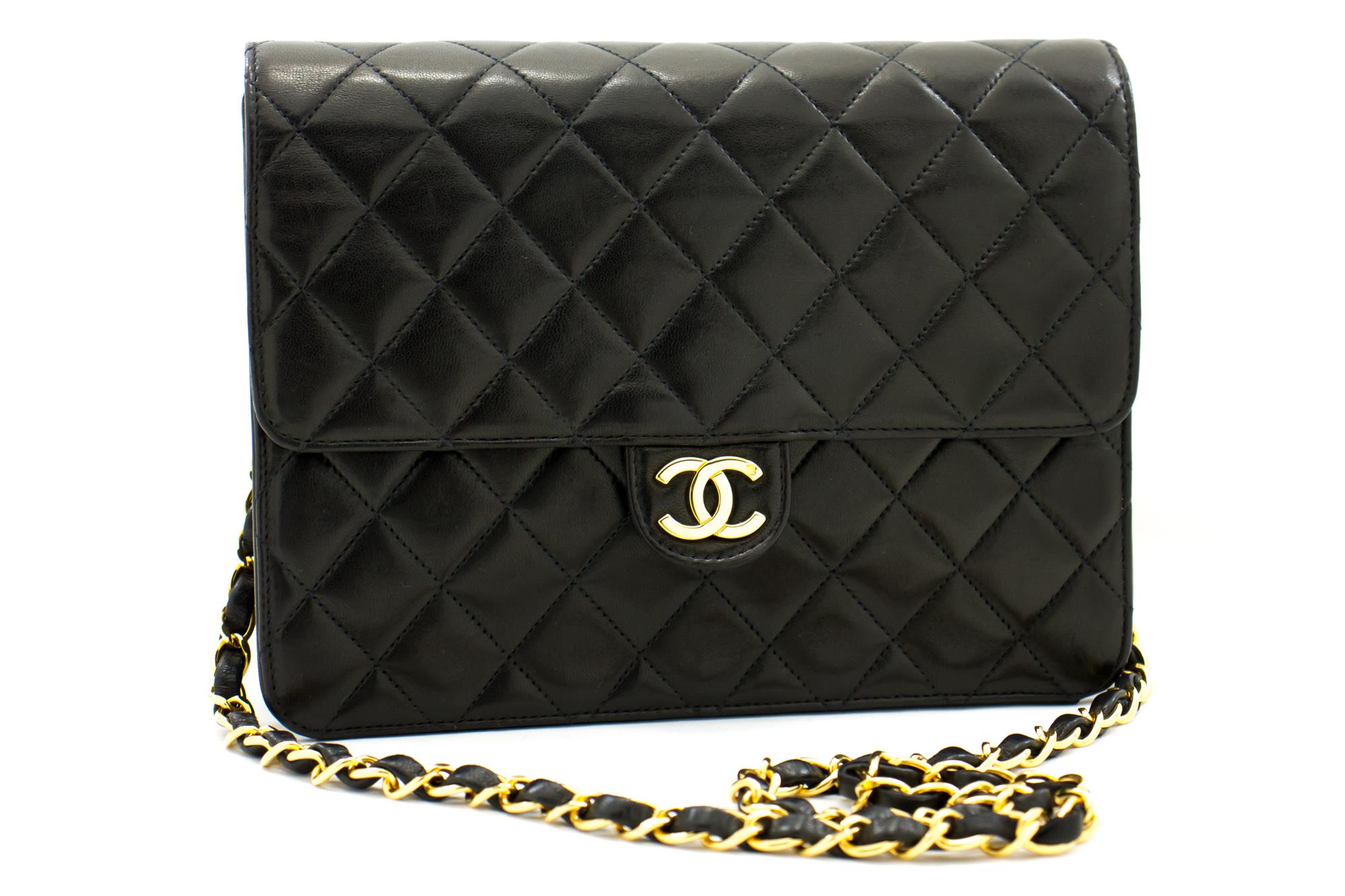 An authentic CHANEL Small Chain Shoulder Bag Clutch Black Quilted Flap made of black Lambskin. The color is Black. The outside material is Leather. The pattern is Solid. This item is Vintage / Classic. The year of manufacture would be