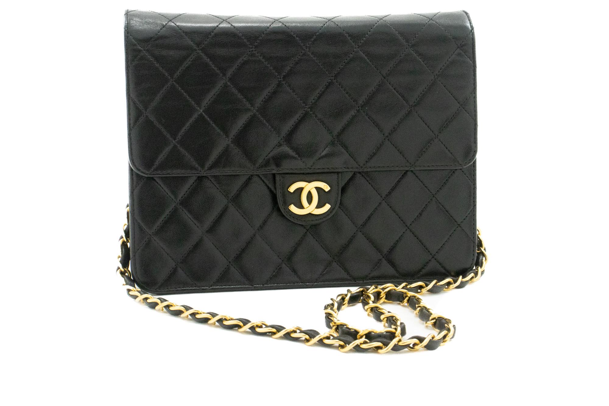 An authentic CHANEL Small Chain Shoulder Bag Clutch Black Quilted Flap made of black Lambskin. The color is Black. The outside material is Leather. The pattern is Solid. This item is Vintage / Classic. The year of manufacture would be