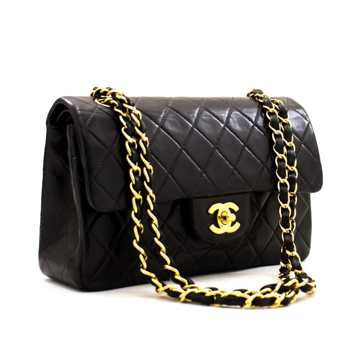 This iconic Chanel 9'' bag is crafted from quilted black lambskin and features a double flap. On the front flap there is the classic CC logo twist lock, and on the second flap a stud closure with one slip-in pocket. The inside lining is covered in