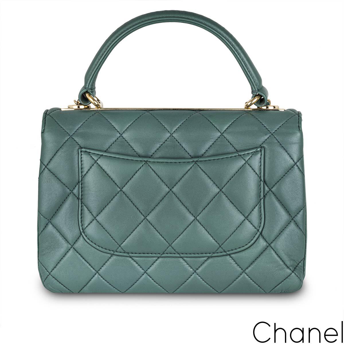 A stylish green Chanel Small Trendy CC Flap Bag. The exterior of this Trendy is crafted with green lambskin leather in the signature diamond style stitching and gold tone hardware. It features a front flap with signature CC turnlock closure, half