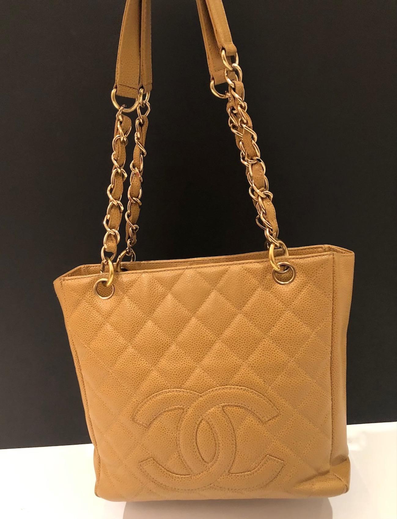 CHANEL Small Petit Shopping Tote Bag Gold Tone Caviar Leather in Camel Beige Circa 2003
A small, very cute rare ‘petit’ 24 cm Chanel tote bag Circa 2003-2004. This PST bag is handcrafted from camel-beige caviar grained leather and finished with