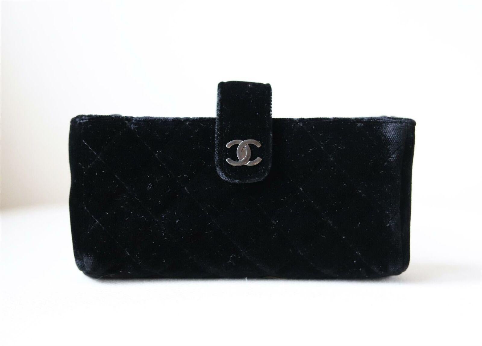 Chanel Small Quilted Velvet Clutch with Long Chain has been hand-finished by skilled artisans in the label's workshop.
Silver CC logo signature on the front closure.
Interwoven silver-tone metal and black leather long chain.
Zipped inner pocket.