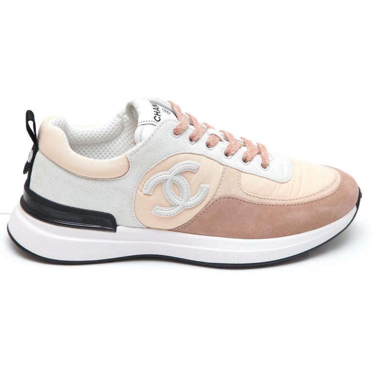 GUARANTEED AUTHENTIC CHANEL 22P BEIGE GREY LACE-UP TRAINER SNEAKERS

Design:
- Beige, light beige and grey fabric and suede uppers.
- CC at sides.
- Quilted soles at sides.
- Fabric insoles.
- Rubber soles.
- Comes with dust bag and extra pair of