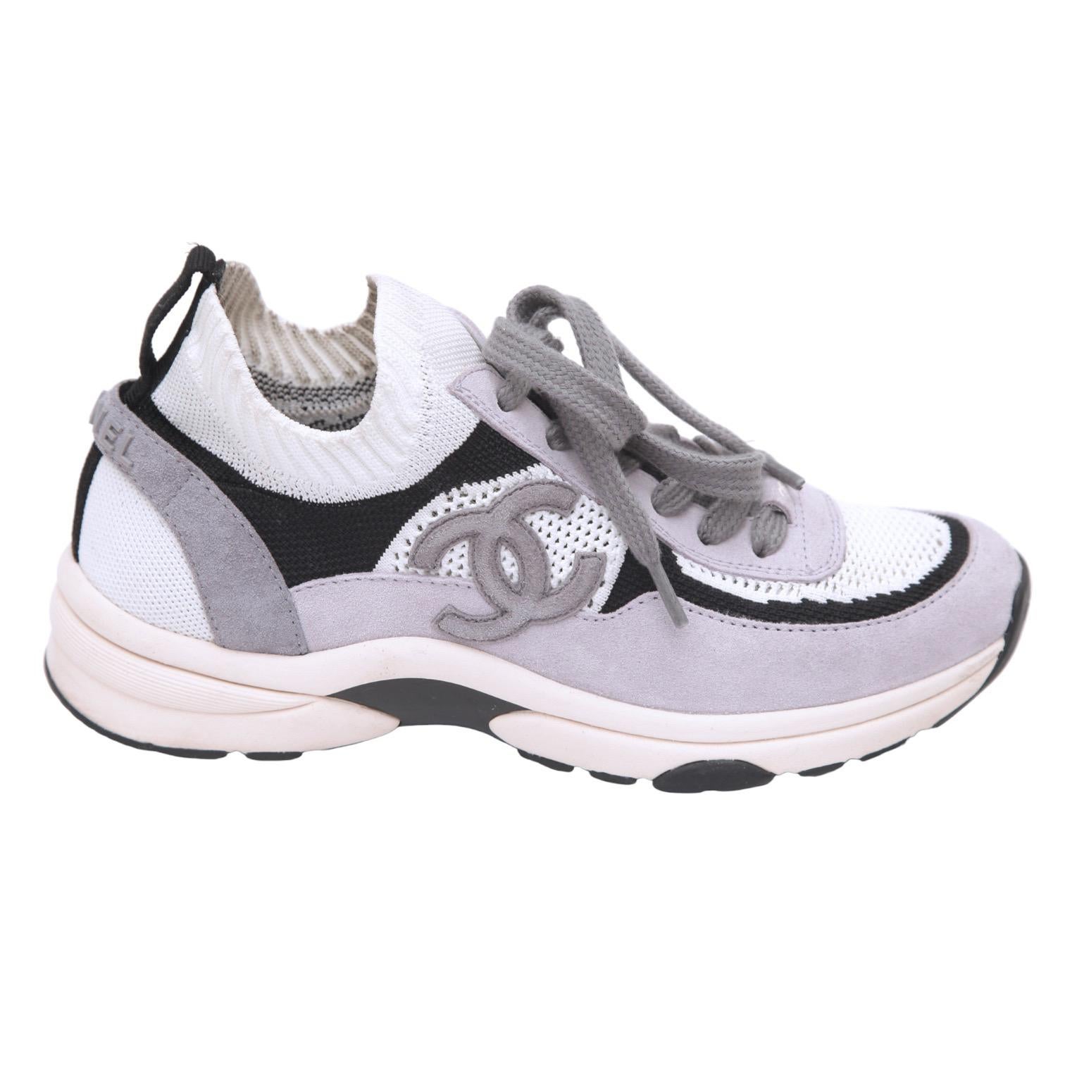 GUARANTEED AUTHENTIC CHANEL 2022 MESH SUEDE WHITE LIGHT LAVENDER SNEAKERS

Retail excluding sales taxes $1195

Design:
- White mer fabric and suede uppers.
- Suede CC at sides.
- Fabric insoles.
- Rubber soles.
- Comes with dust bag.

Size: