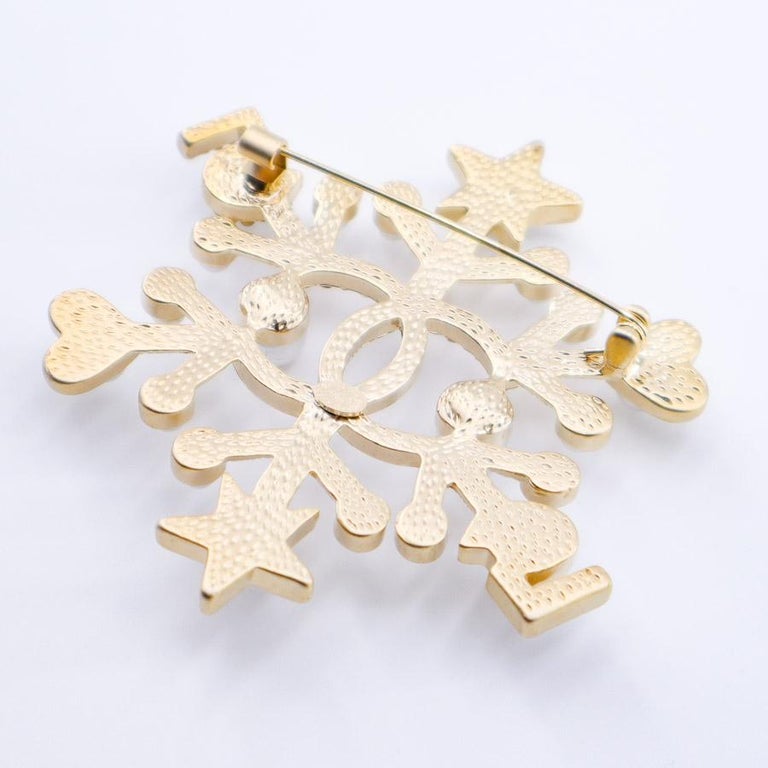 CHANEL Snow Star Brooch at 1stDibs  chanel brooch star, cc brooch ,  chanel planet brooch