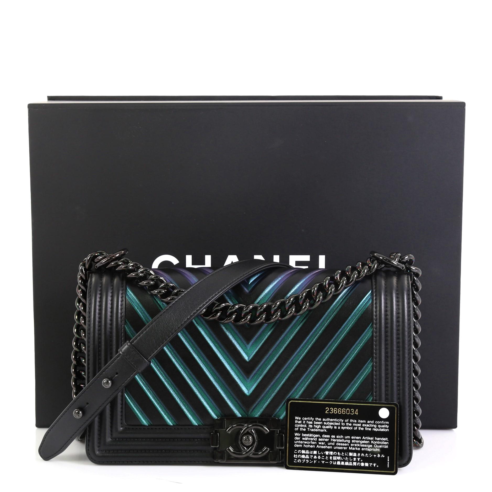 This Chanel So Black Boy Flap Bag Chevron Painted Calfskin Old Medium, crafted from black and multicolor chevron painted calfskin leather, features chain link strap with leather pad and gunmetal-tone hardware. Its CC Boy push lock closure opens to a