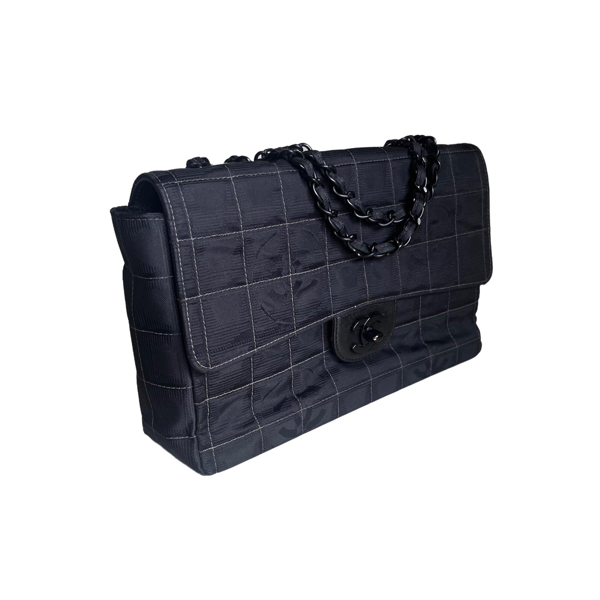 Chanel So Black Canvas Classic Flap 2002 Ice Cube Chocolate Bar Shoulder Bag These are professional photos of the actual bag offered by Luxbags. In recent years, multiple brands have released handbags with a monochromatic all-black design, featuring