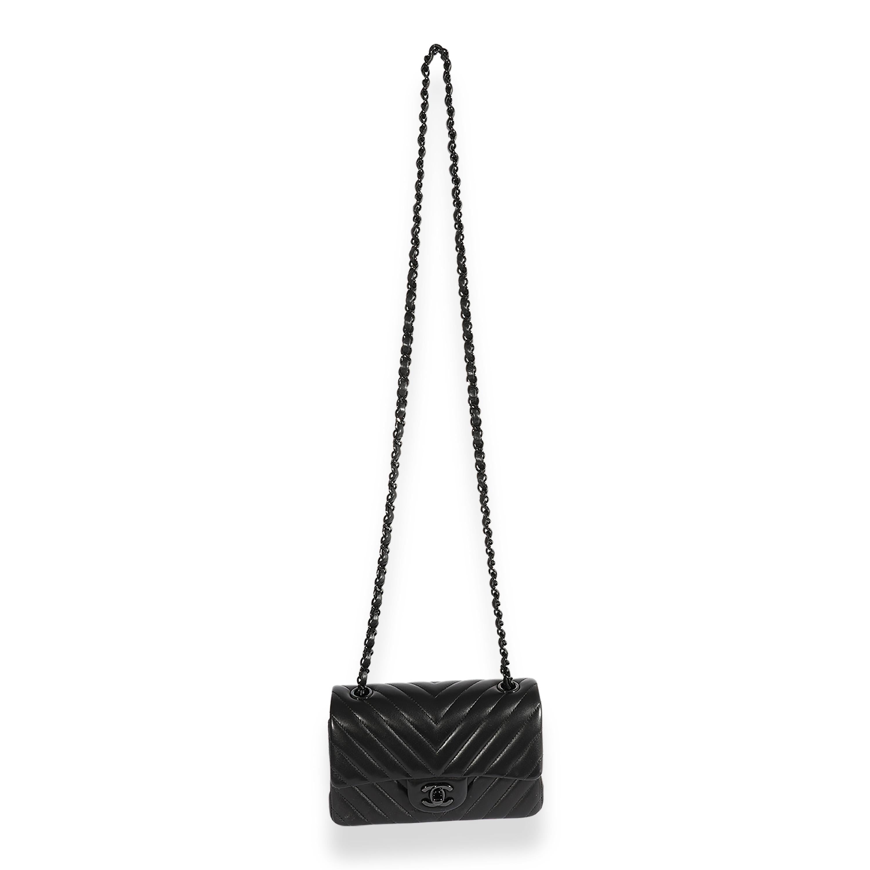Listing Title: Chanel So Black Chevron Quilted Lambskin Mini Rectangular Classic Flap
SKU: 124204
Condition: Pre-owned 
Handbag Condition: Very Good
Condition Comments: Light scuffing throughout exterior. Faint scratching at hardware. Interior