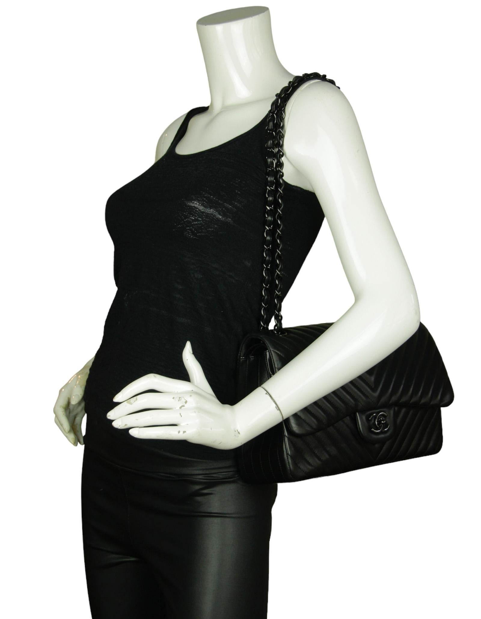 Chanel SO Black Lambskin Leather Chevron Quilted Double Flap Jumbo Flap Bag

Made In: Italy
Year of Production: 2015
Color: Black
Hardware: Black
Materials:  Lambskin leather
Lining: Smooth black leather
Closure/Opening: Flap top with CC twist