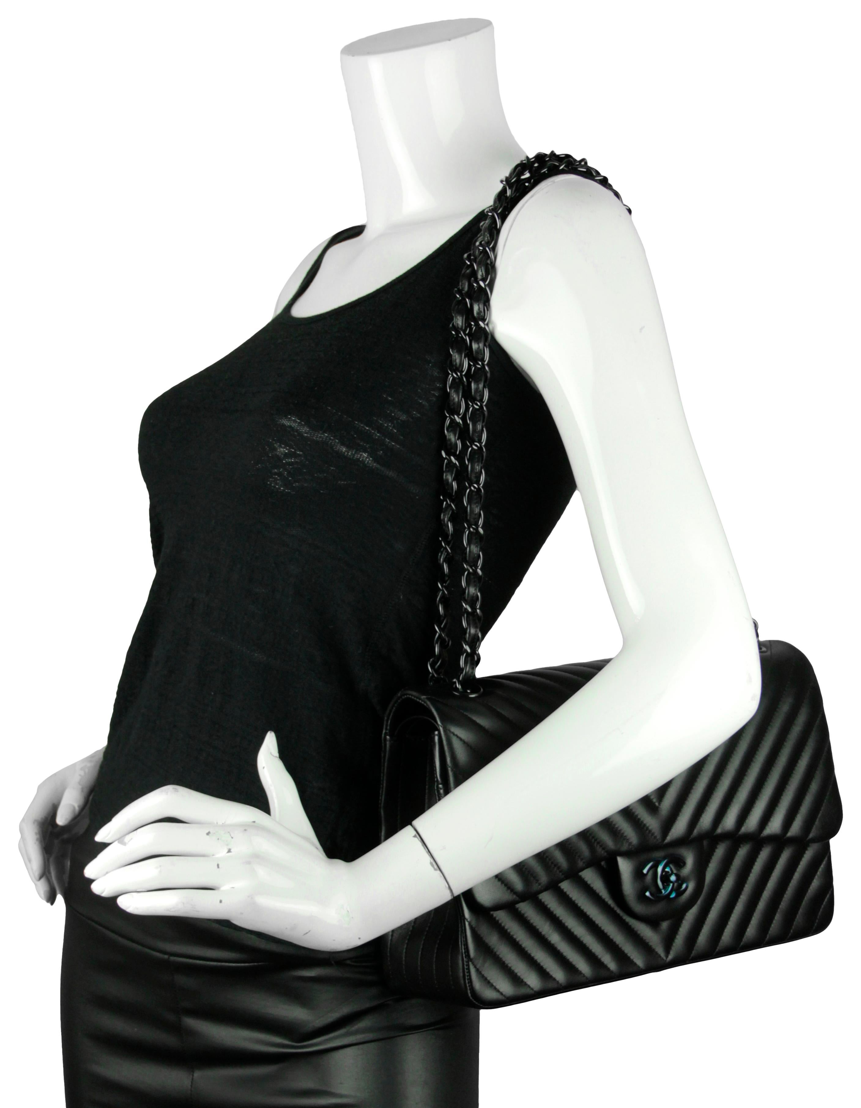 Chanel SO Black Lambskin Chevron Quilted Double Flap Jumbo Flap Bag

Made In: Italy
Year of Production: 2015
Color: Black
Hardware: Black
Materials:  Lambskin leather
Lining: Smooth black leather
Closure/Opening: Flap top with CC twist lock
Exterior
