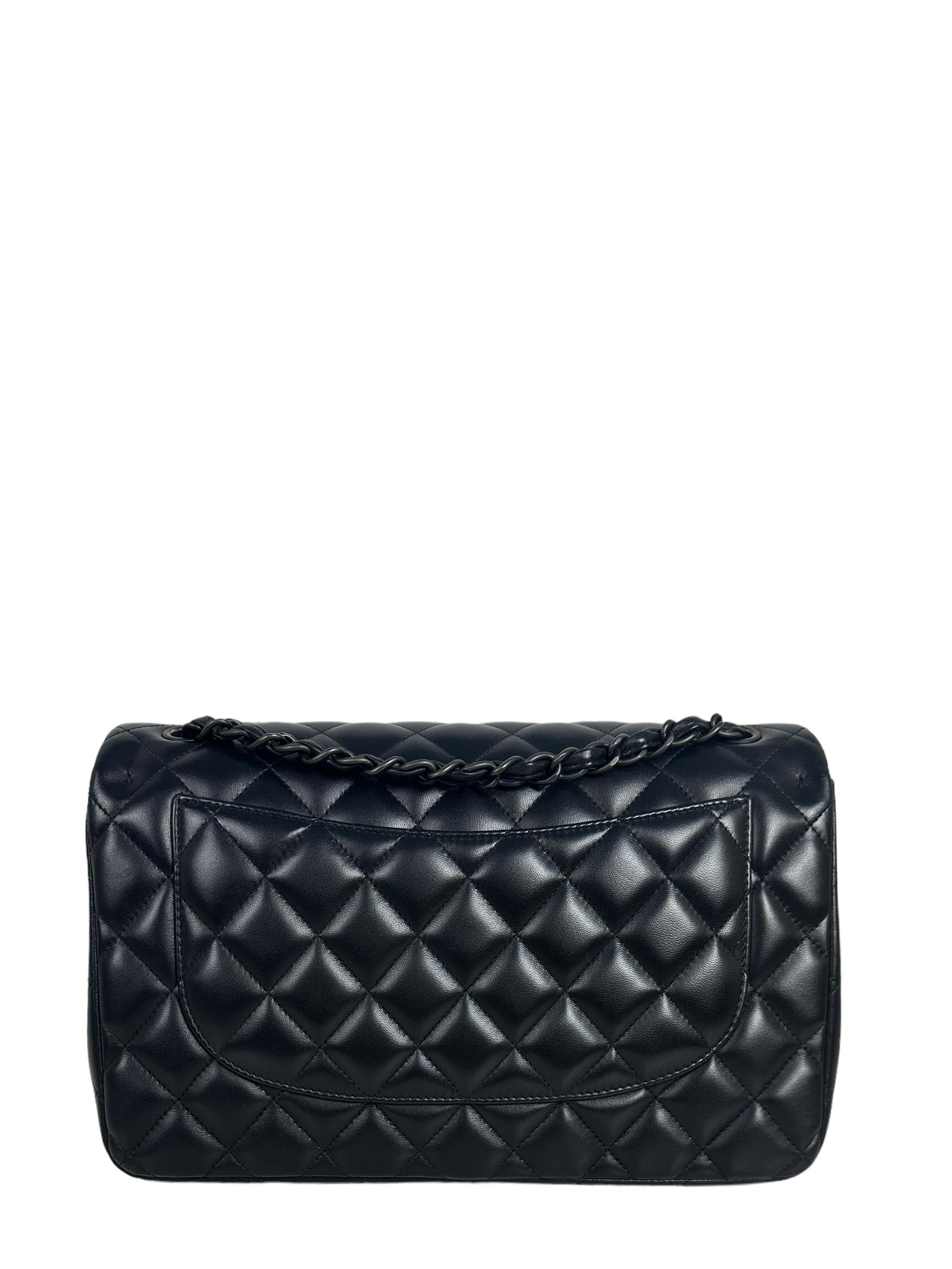 Chanel SO Black Lambskin Leather Quilted Classic Double Flap Jumbo Bag 

Made In: Italy
Year of Production: 2013
Color: Black
Hardware: Black
Materials: Lambskin Leather
Lining: Black leather
Closure/Opening: Top flap with CC turnlock
Exterior