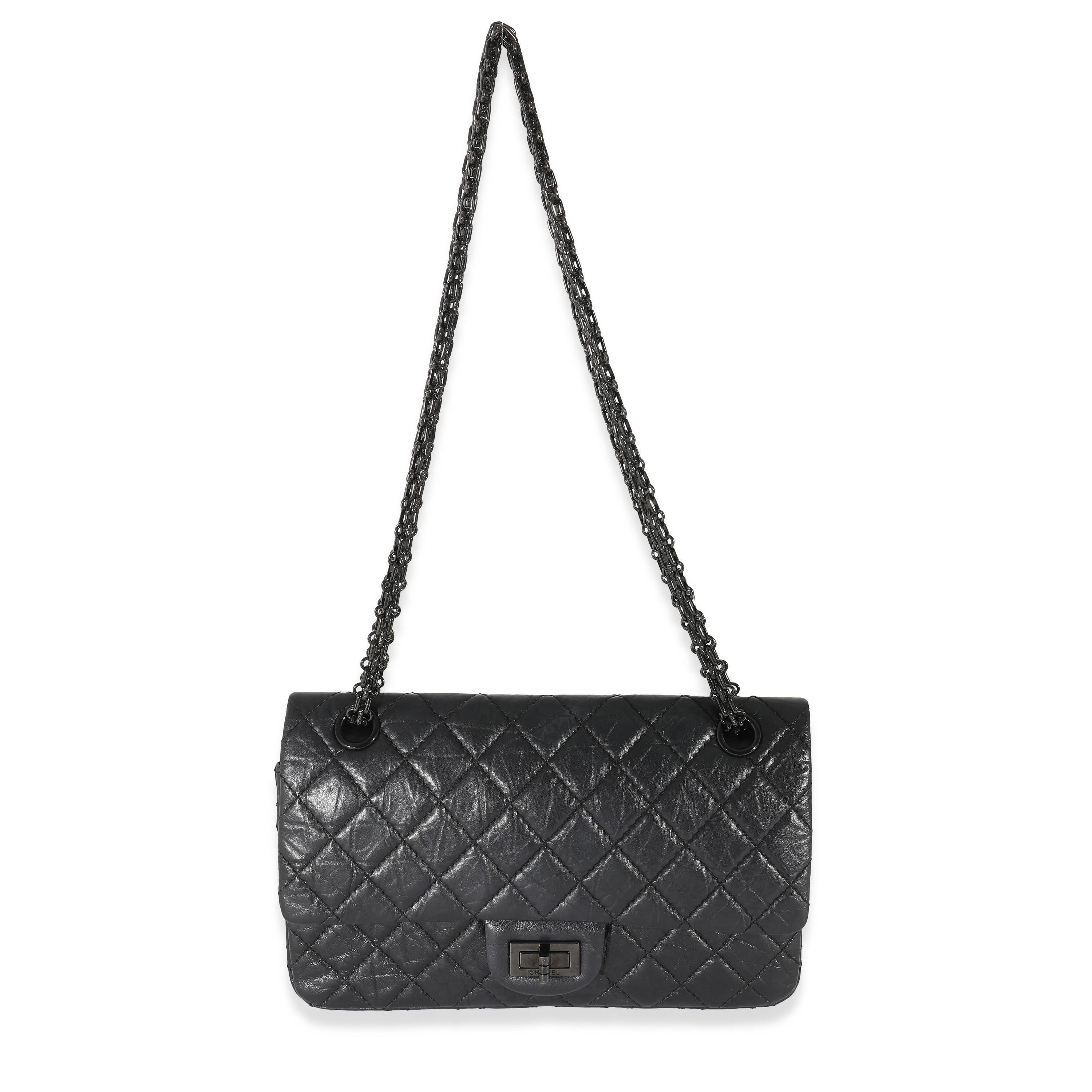 Listing Title: Chanel So Black Quilted Calfskin 2.55 Reissue 225 Double Flap Bag
SKU: 133145
Condition: Pre-owned 
Condition Description: A timeless classic that never goes out of style, the flap bag from Chanel dates back to 1955 and has seen a