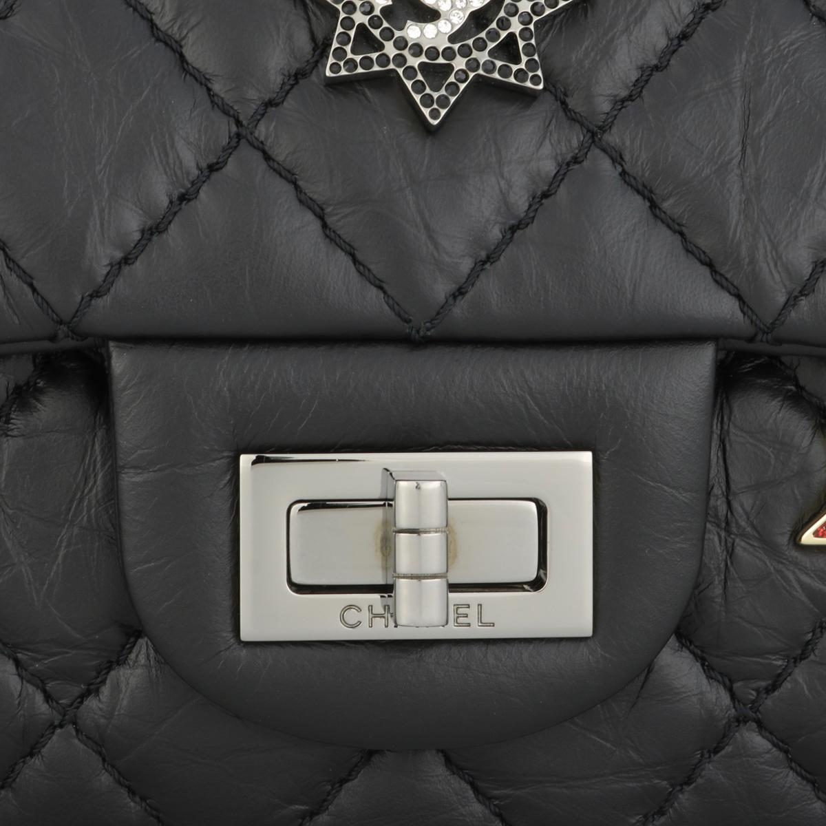 Women's or Men's CHANEL Space Charms 2.55 Reissue 225 Flap Bag Black Aged Calfskin 2017 For Sale