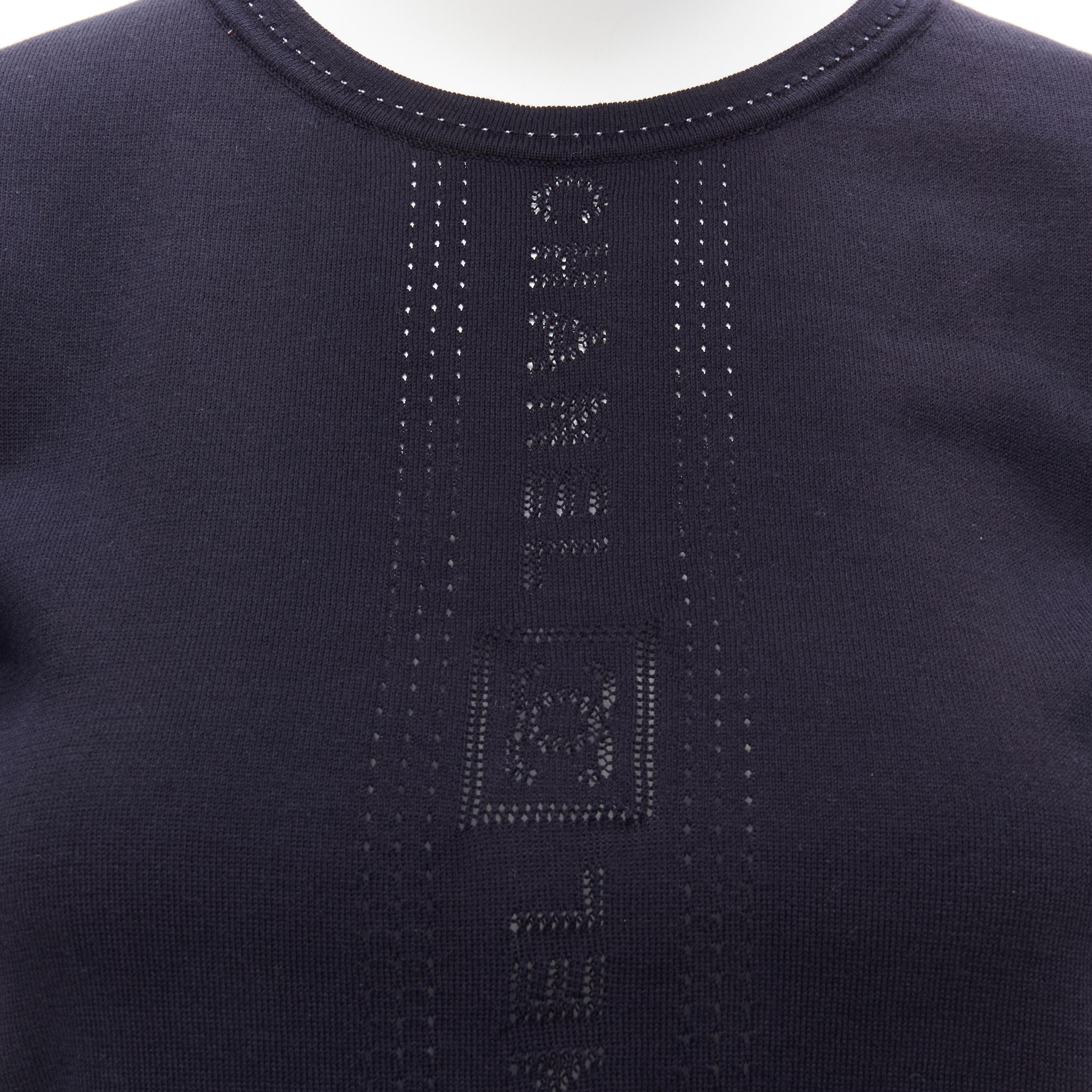 CHANEL SPORTS 07C Vintage navy CC logo perforated short sleeve top FR36 S
Reference: TGAS/D00304
Brand: Chanel
Designer: Karl Lagerfeld
Collection: Sports
Material: Cotton
Color: Navy, White
Pattern: Solid
Closure: Pullover
Extra Details: Discreet