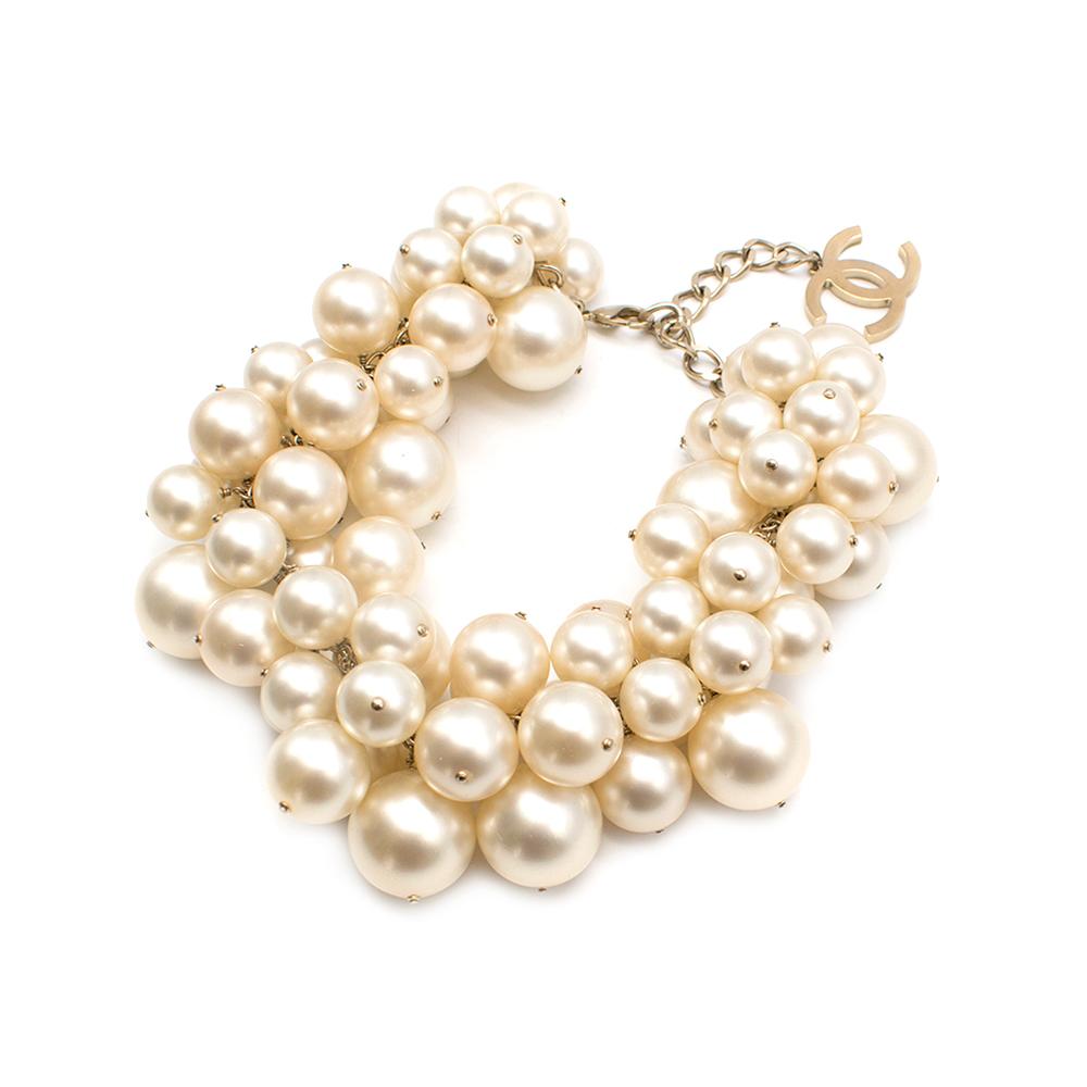 Chanel Spring '13 Runway Faux Pearl Cluster Necklace

-Featured on the Spring/Summer 2013 Runway
- Short Choker style
- Faux pearls in varying sizes clustered together on a gold tone chain
-CC logo charm.
-Clasp Closure

Approx drop 17-22cm
