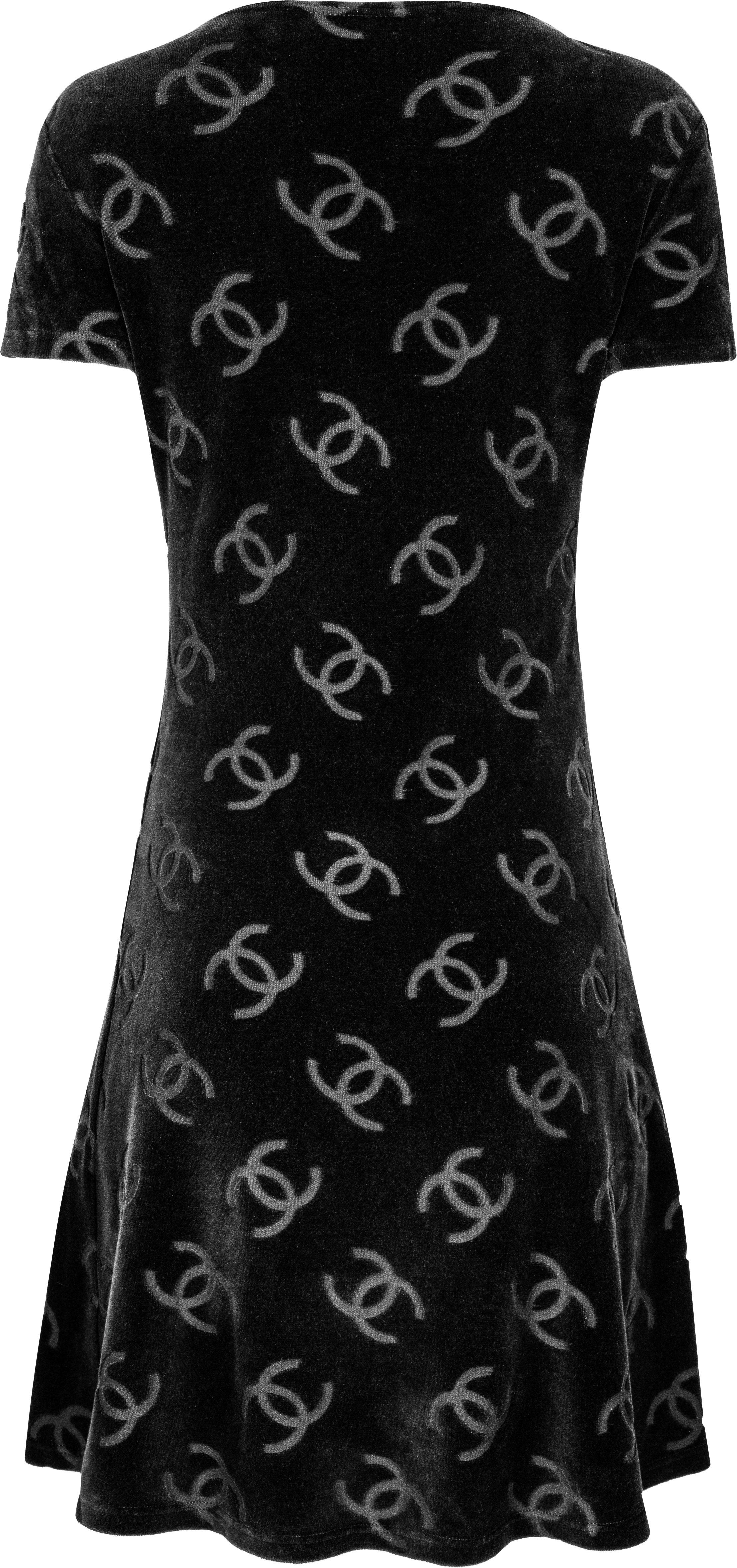 Iconic velour mini dress in black with Chanel logo print from the spring 1996 runway collection designed by Karl Lagerfeld for Chanel.

Bust: 32-36