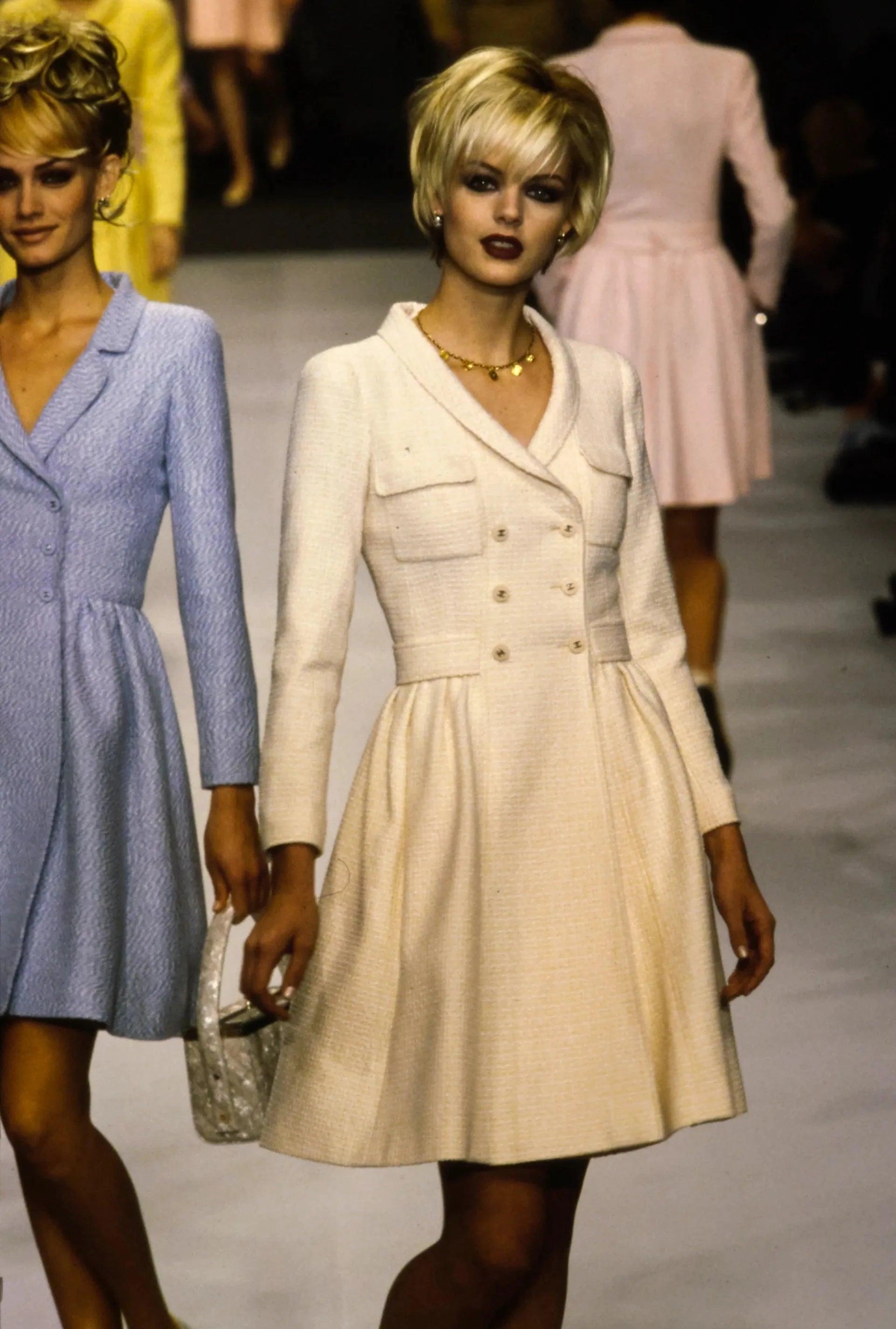 Vintage Chanel
by Karl Lagerfeld
Spring 1996 - seen on the runway & in campaign image in blue

Light peach tweed jacket / dress
Pleated skirt
Double breasted closure
CC buttons on front, cuffs and back
Notched lapels
CC pattern silk lining

47%