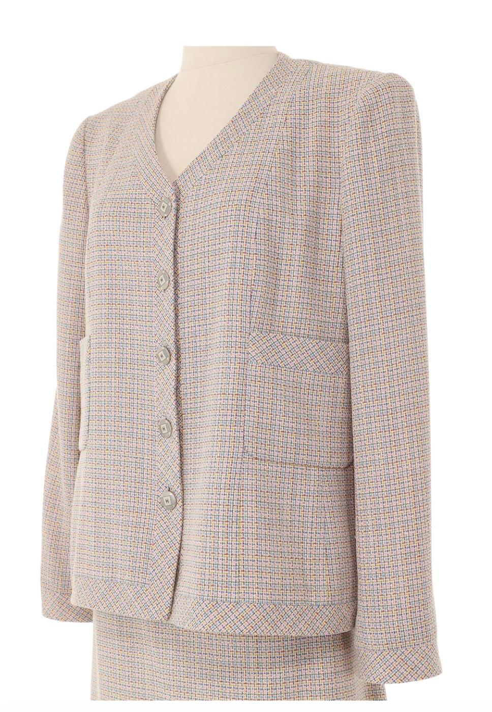 Chanel Spring 1998 Cream Multicolored Skirt Suit. From the 1998 Chanel collection by Karl Lagerfeld, this skirt suit strikes a balance between sophistication and playfulness. The mulitcolored tweed adds a fun detail to a classic Chanel silhouette.