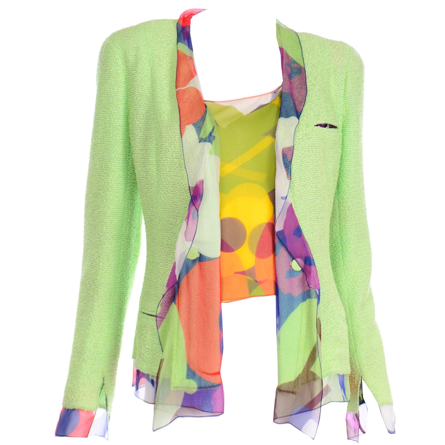 This colorful Spring Green Chanel jacket is in a beautiful bouclé and is lined with a floral silk chiffon. We are also including the floral silk top from the same collection that matches the inner lining of the jacket. The shoulders are structured