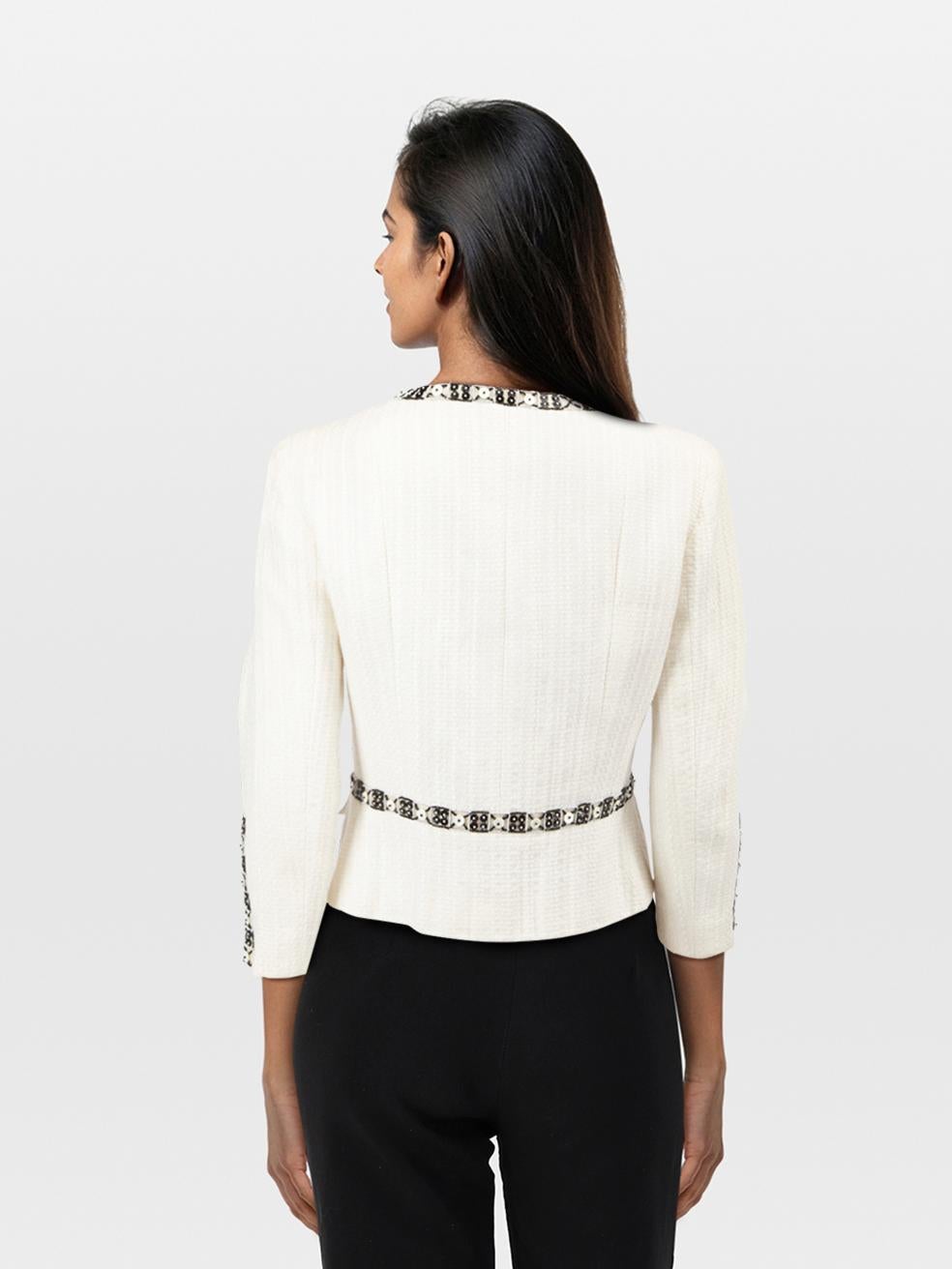 CONDITION is Very good. Minimal wear to the jacket is evident. Discolouration on the front left, left sleeve, armpit lining and lining of the back neck. Loose and missing embroidery on the centre front of this used Chanel designer resale item.