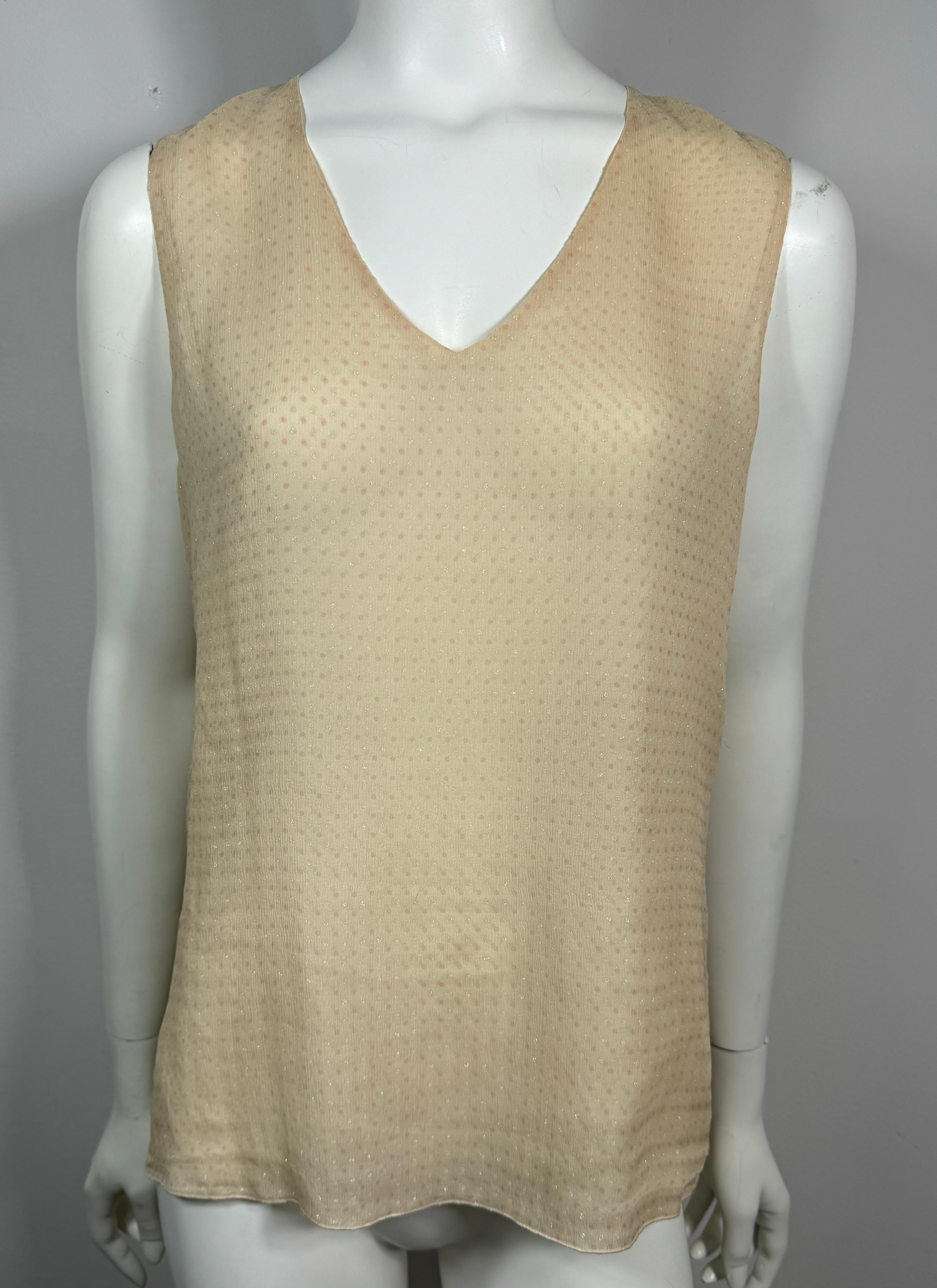 Chanel Spring 2005 Cream Pink and Gold Sleeveless Silk Top-Size 42 This elegant cream colored double lined silk chiffon sleeveless top has tiny light pink and light gold polka dot pattern. The top has a v neck, 4.25” slit in top back with hook and