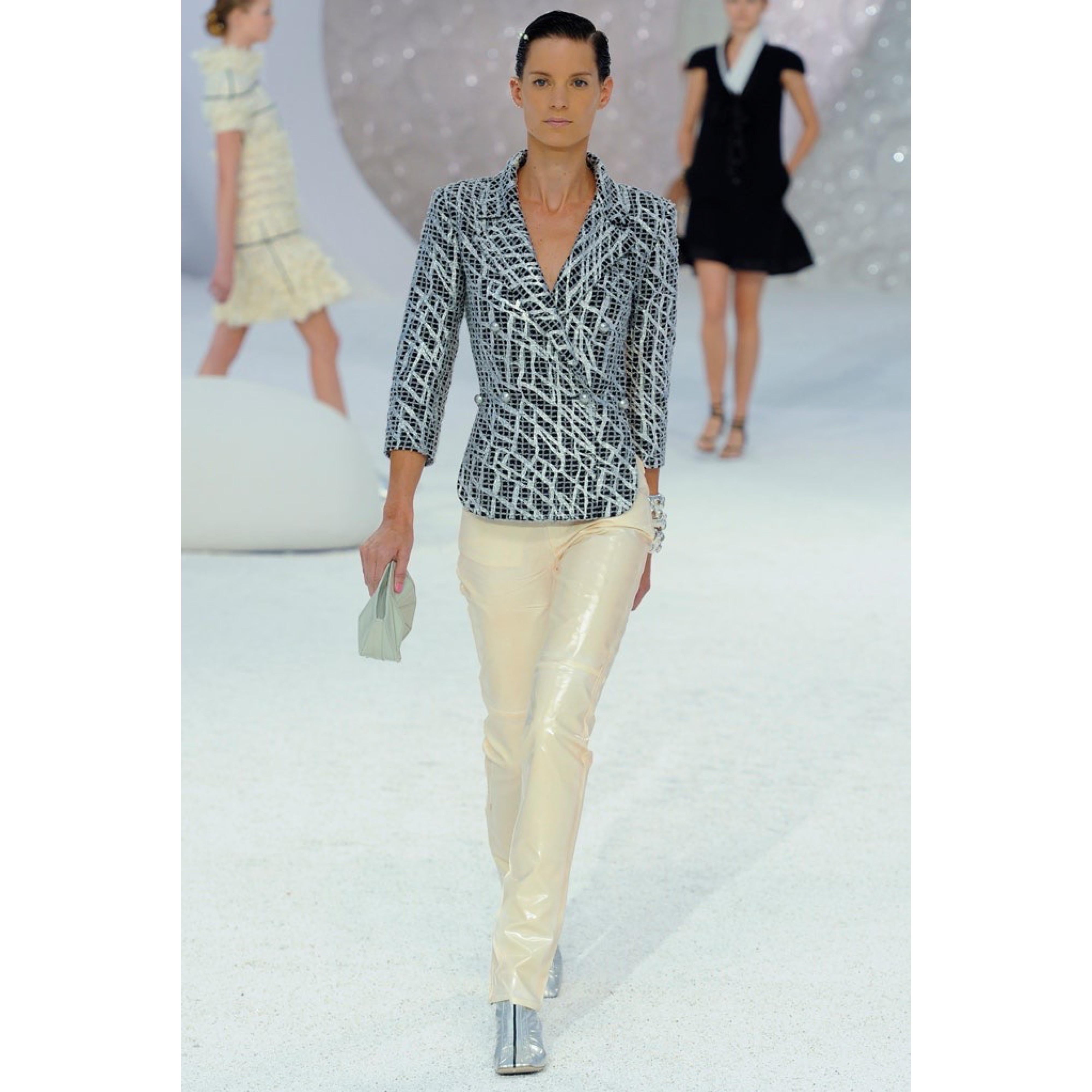 Beautiful never worn Chanel by Karl Lagerfeld black, white and metallic silver double breasted runway blazer jacket. Hand painted silver graffiti print throughout. Silver faux pearl buttons. Soft fabric blend of cotton (52%), nylon (28%), and wool