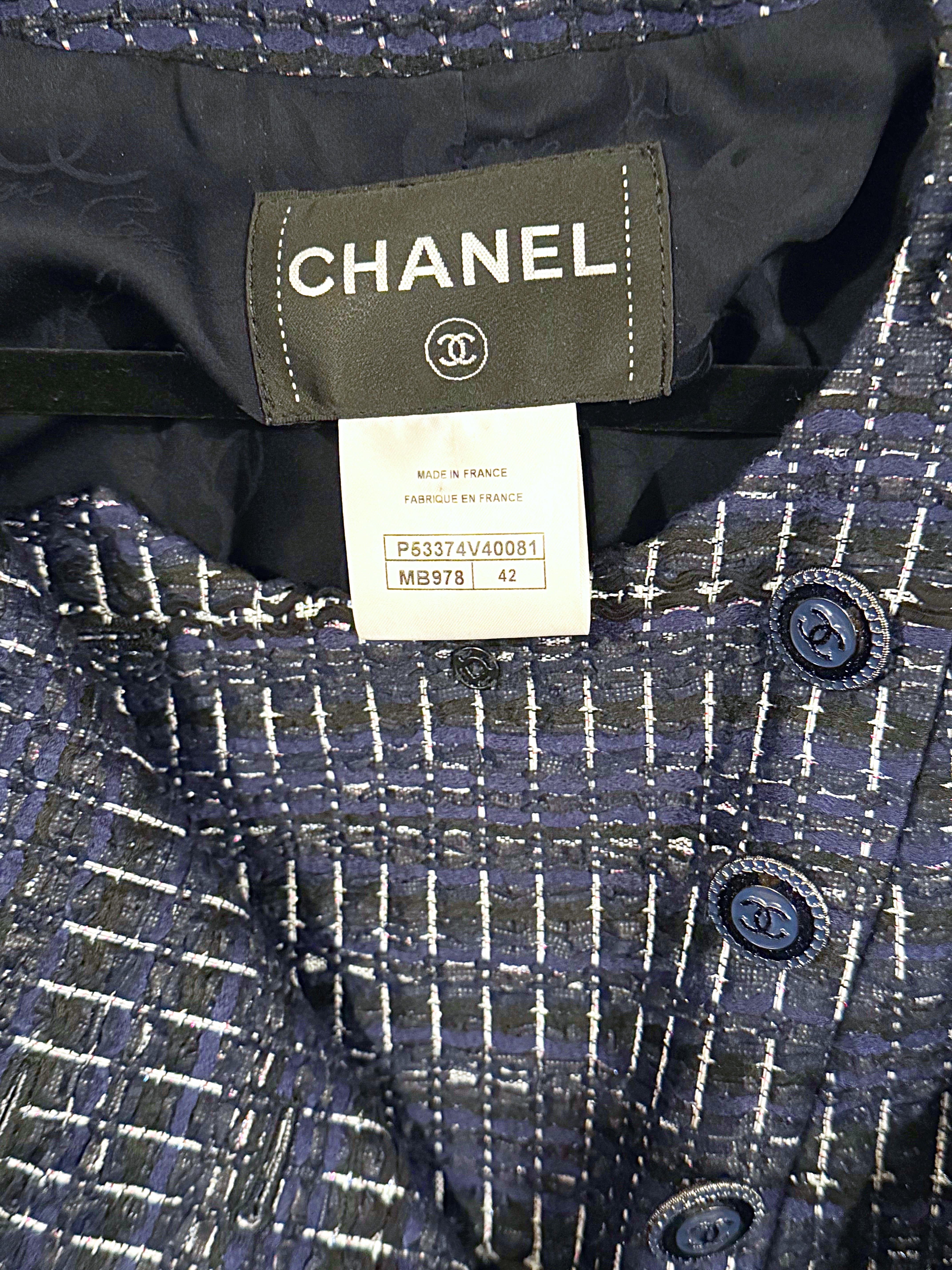 Beautiful Chanel, by Karl Lagerfeld, Spring 2016 navy blue fantasy tweed dual breasted jacket ! Features a luxurious fabric blend of Acrylic (29%), Polyester (37%), Nylon (26%), Metalized Polyester (6%), and Cotton (2%). Double breast fit with metal