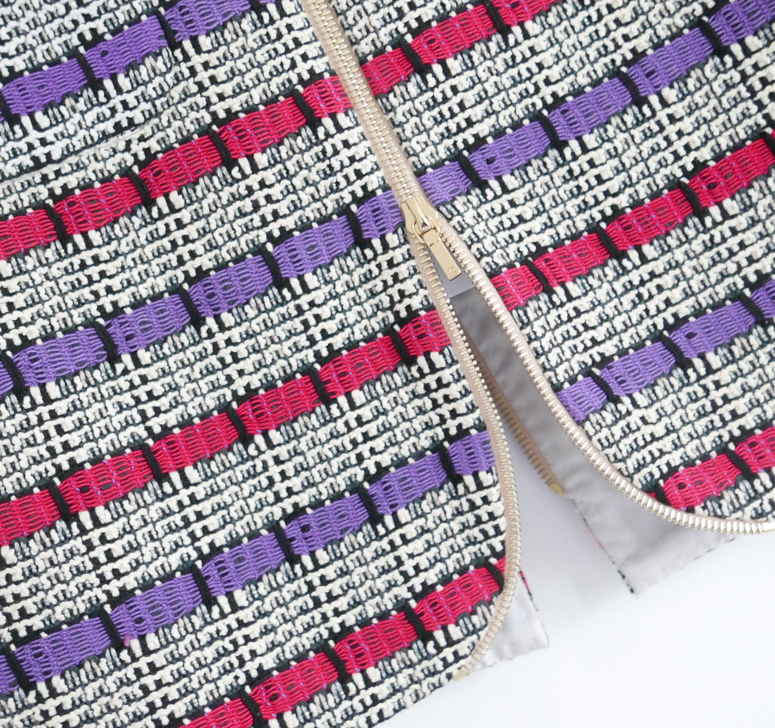 Totally fabulous Chanel skirt - from the Spring/Summer 2017 17S collection. Bought for £2700 and new with spare fabric/tag attached. 

Superbly crafted from chunky cotton/acrylic mix black and white tweed with pink and purple textured stripes. It