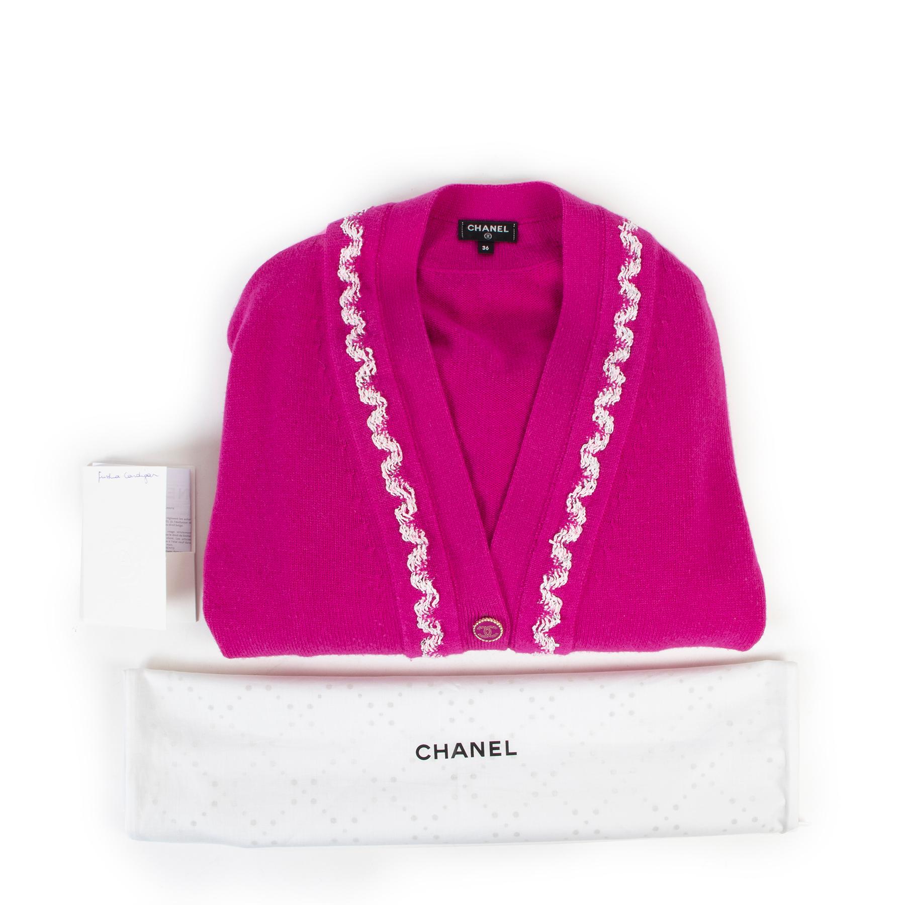 Chanel Fuchsia Spring 2021 Cashmere Cardigan - Size 36

Seen on K-pop star G-Dragon, this iconic fuchsia pink cardigan from Chanel is made from 100% luxuriously soft cashmere, adorned with white tread trimming and jewel-like buttons.

Comes