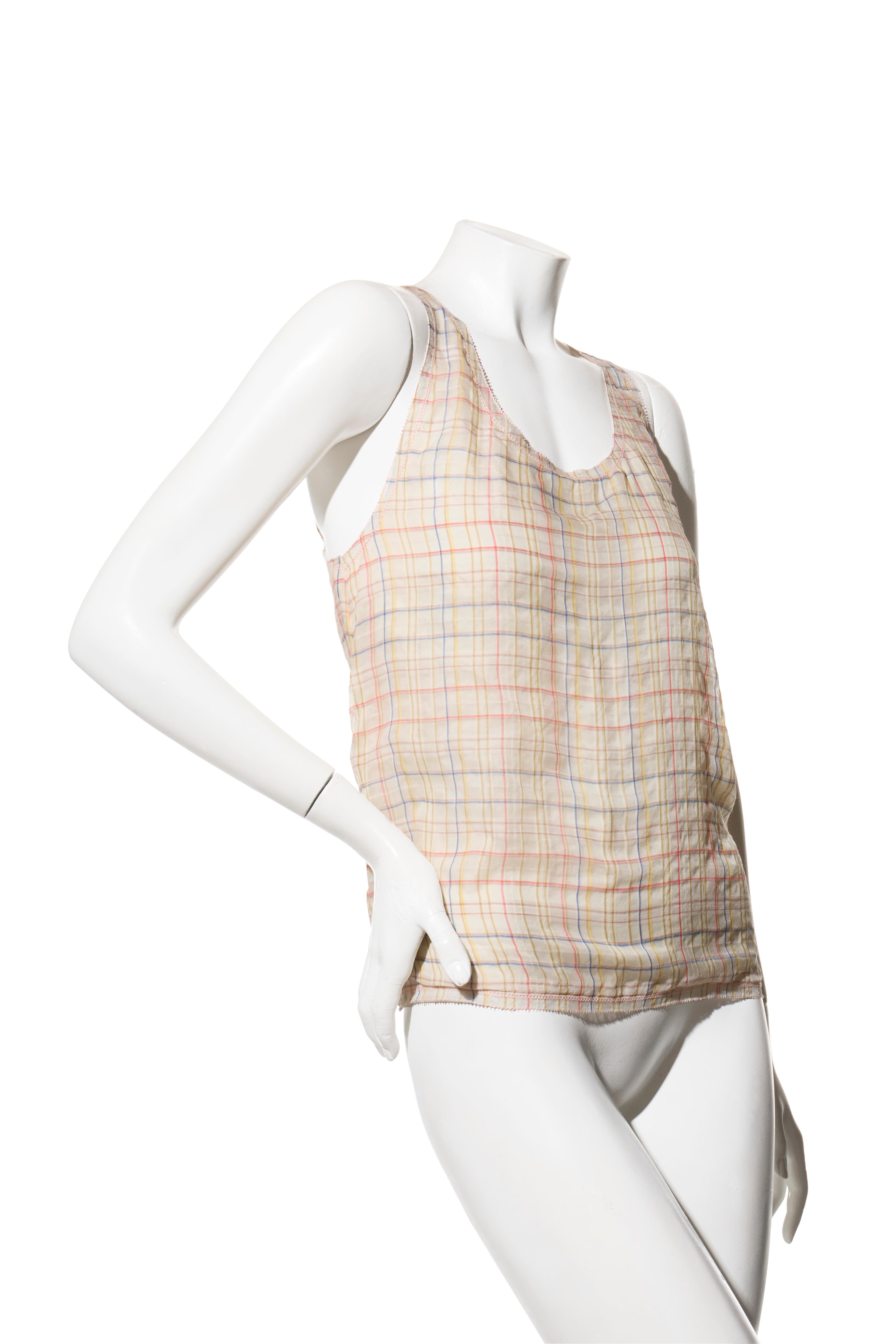 Chanel Spring Summer 2017 Pastel Plaid Cotton-Silk Sleeveless Top FR38

Description :
Issu de la collection printemps/été 2017 de Chanel, ce haut à carreaux sans manches incarne l'élégance française intemporelle. Confectionné en France dans un