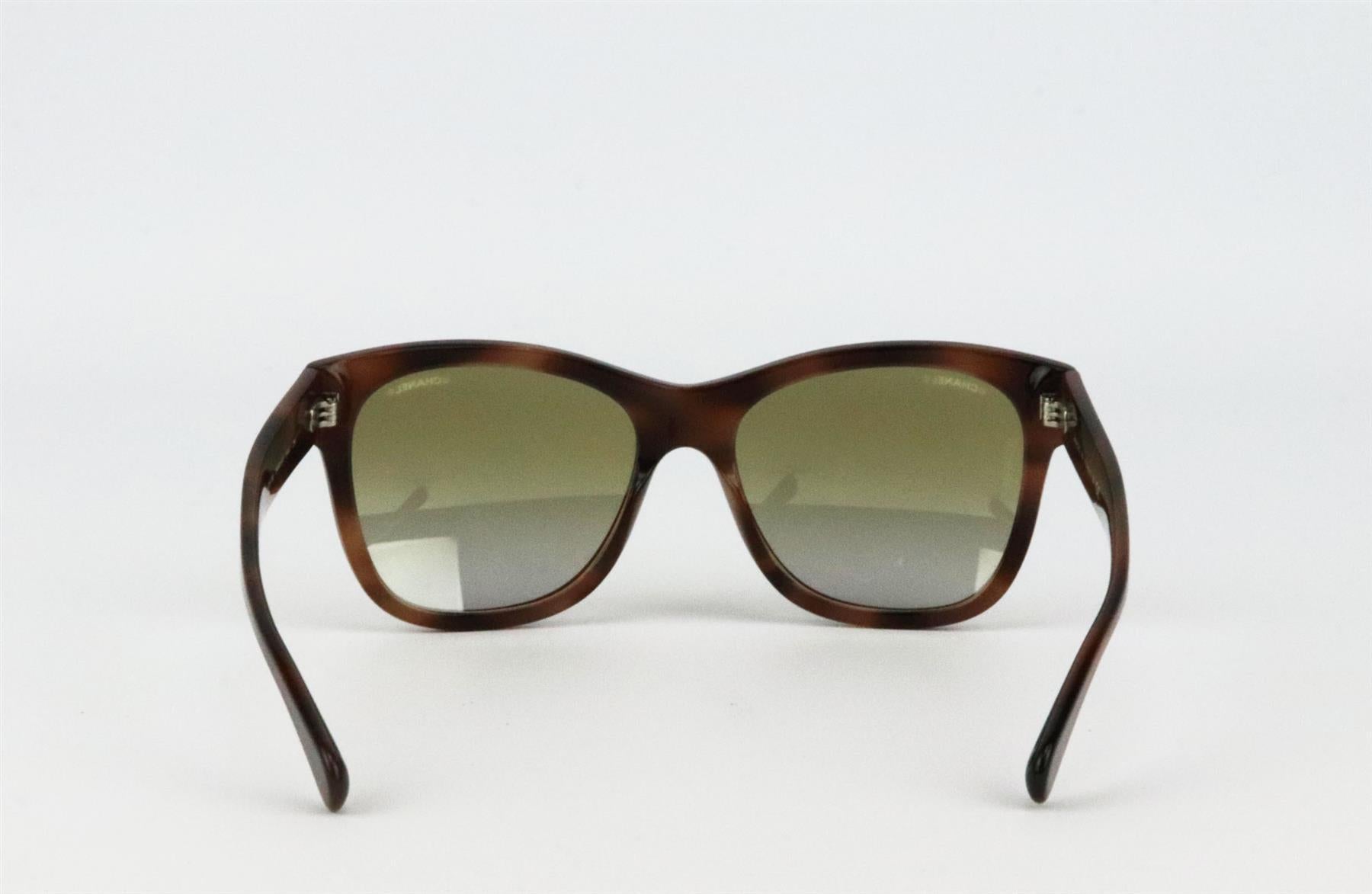 These sunglasses by Chanel have been handmade from naturally flexible brown tortoishell acetate, and feature a square-frame silhouette and finished with the brand’s signature silver-tone CC on the temples. Brown acetate. 100% UV protection.Does not